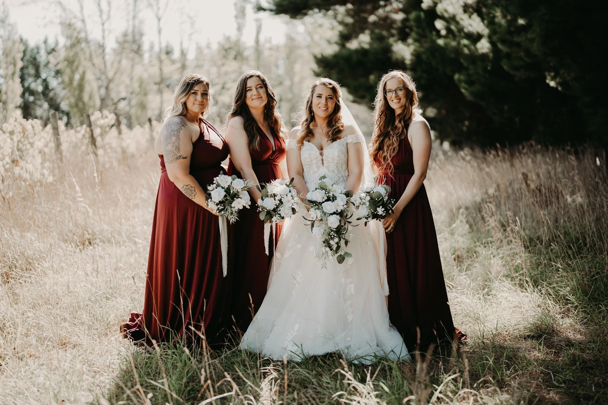 new zealand florist showcasing white modern florals with bridal party