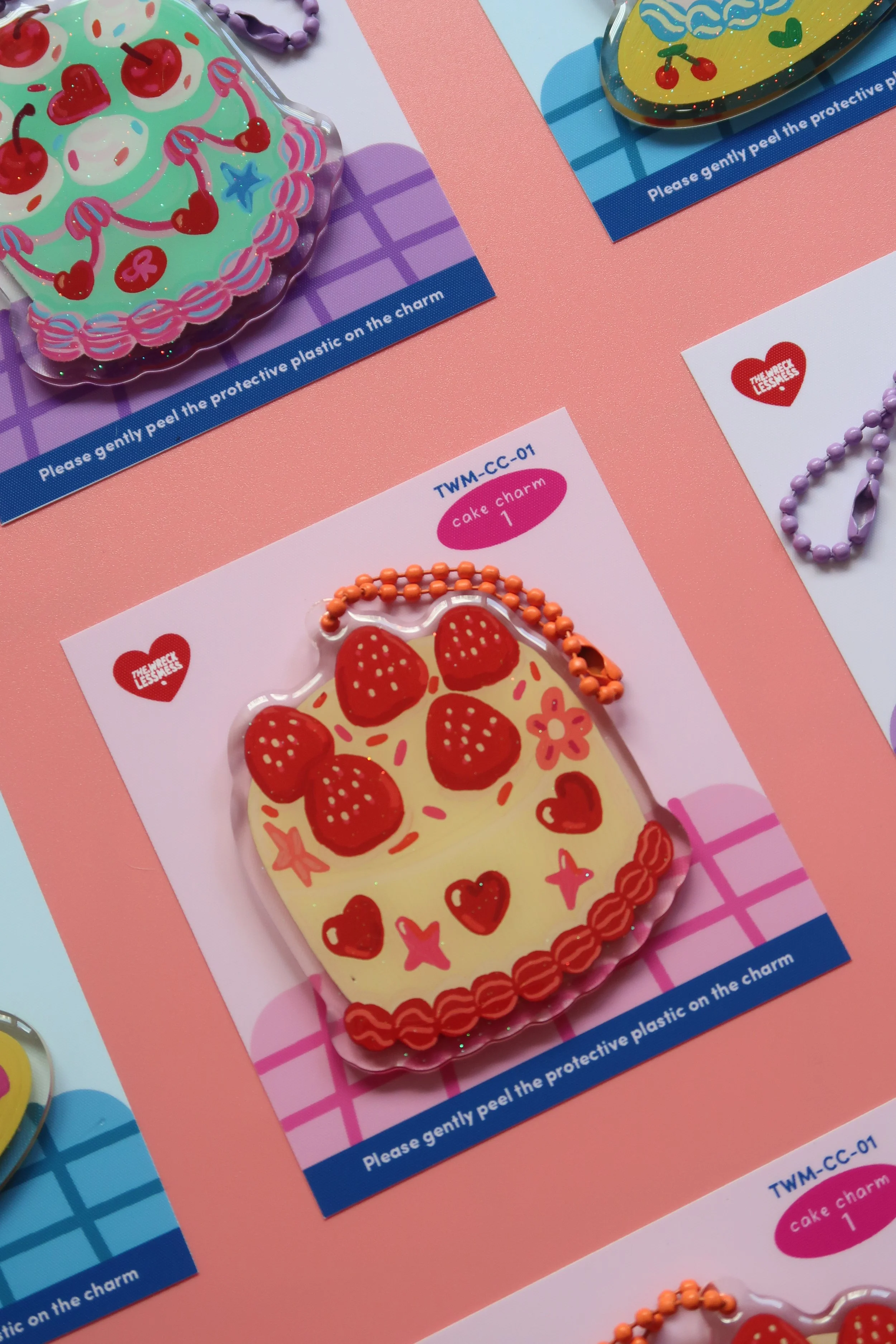 Glitter and rounded acrylic cute cake charm. Approx. 6cm. Suitable for bags, and keychains. Illustrated by Nina Zai in Singapore. The Wrecklessmess.