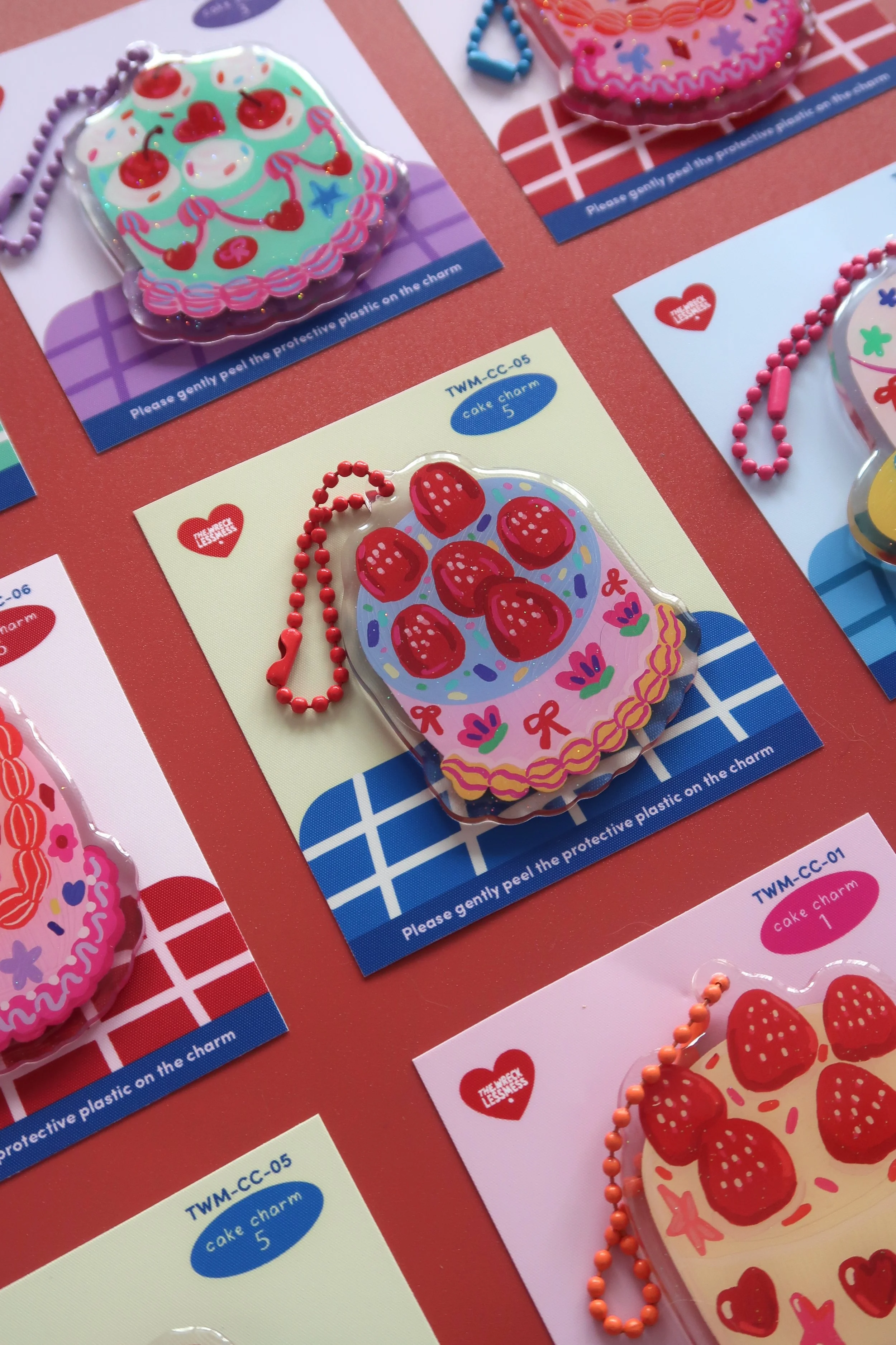 Glitter and rounded acrylic cute cake charm. Approx. 6cm. Suitable for bags, and keychains. Illustrated by Nina Zai in Singapore. The Wrecklessmess.