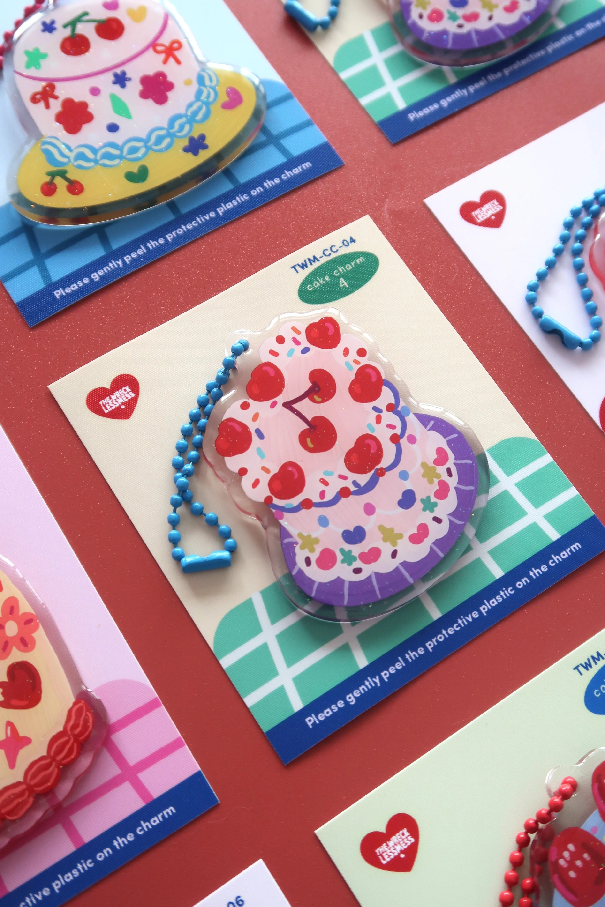 Glitter and rounded acrylic cute cake charm. Approx. 6cm. Suitable for bags, and keychains. Illustrated by Nina Zai in Singapore. The Wrecklessmess.