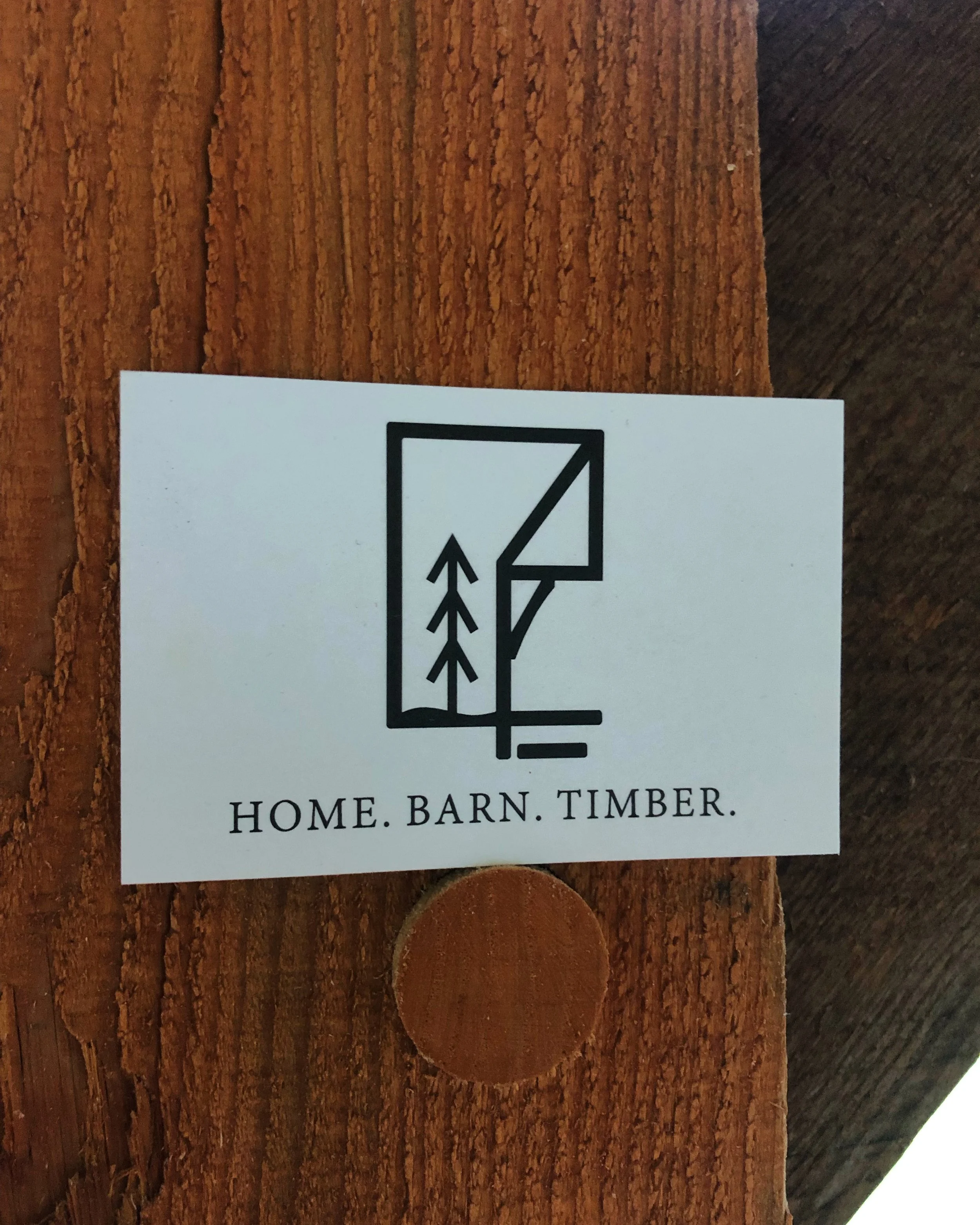 Logo with a stylized house, tree, and timber, and the text "Home. Barn. Timber." underneath.