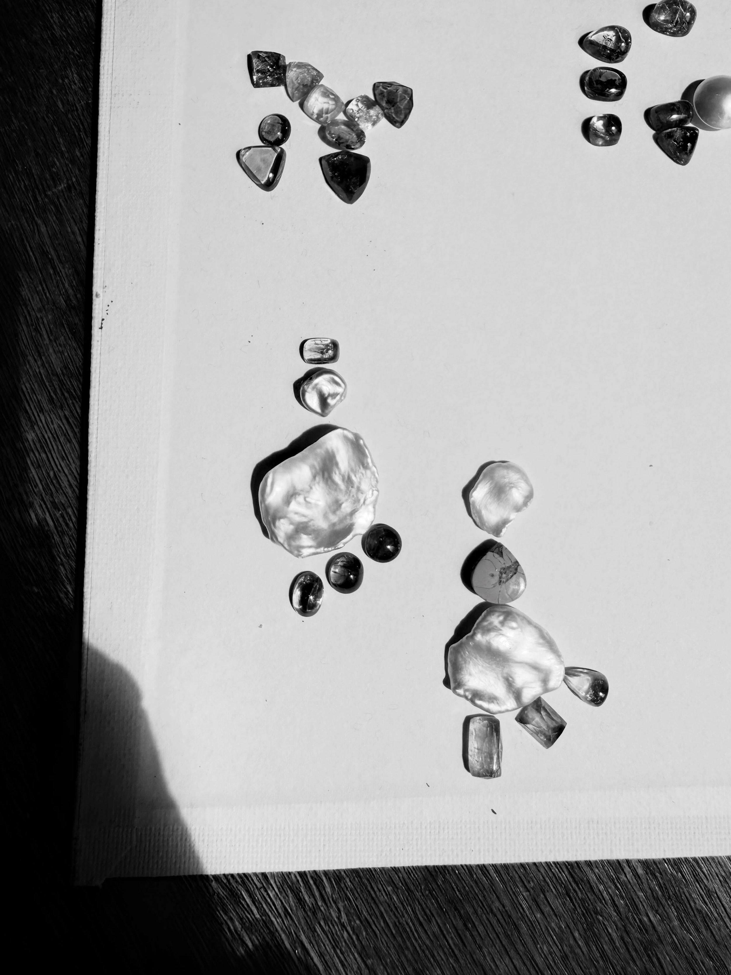 Found symmetry in imperfect things.
Fragments of baroque pearls, scattered stones, and shifting light &mdash; all different shapes, all carrying their own quiet history. I love how the most irregular pieces create the most interesting compositions. N