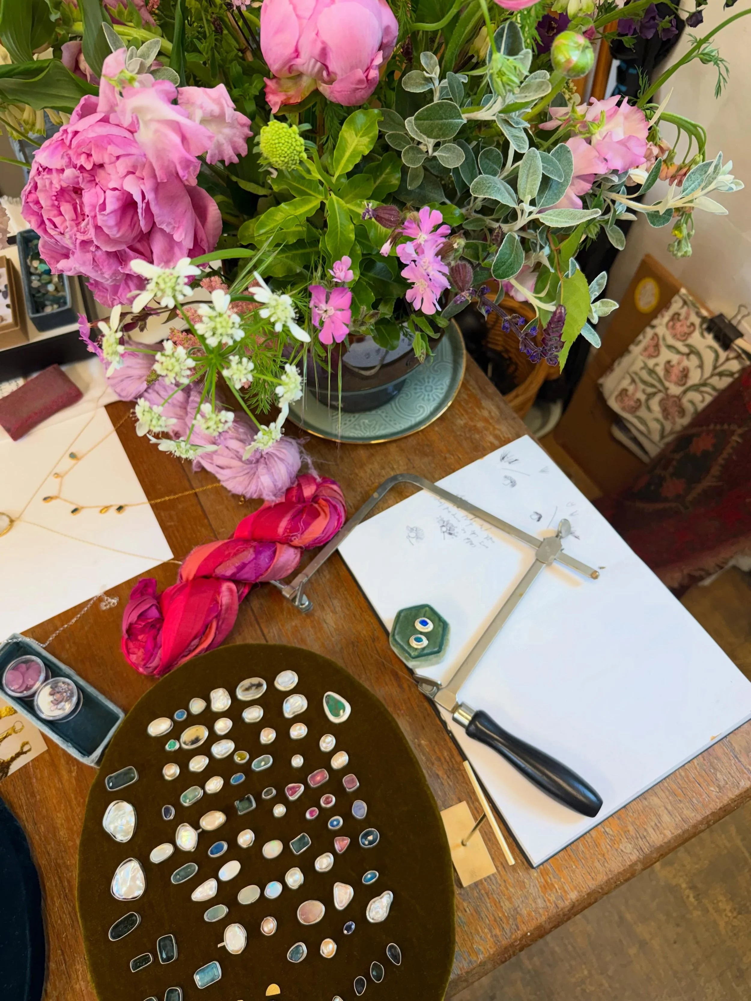 The studio is full of light and colour. Sketchbooks bursting with ideas ready to come to life. Unearthed jewels placed with care, making the most beautiful pallet of vivid colour for me to select from.
