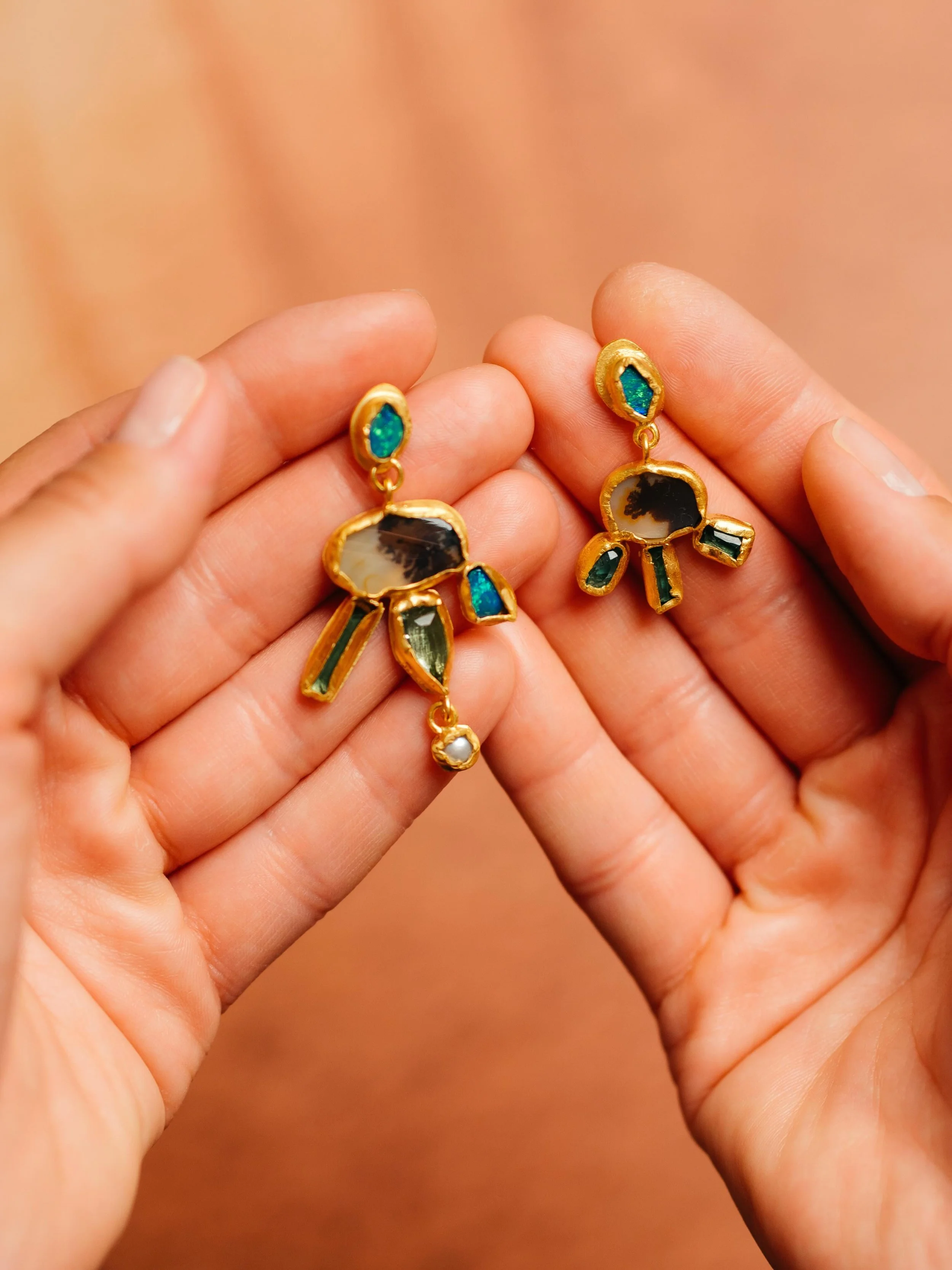 FALLEN RELICS

A new collection of sculptural adornments composed from unearthed stones, gathered forms and forged textures.

Opals, dendritic agates, tourmalines and pearls assembled into one-of-a-kind contemporary relics &mdash; each piece entirely