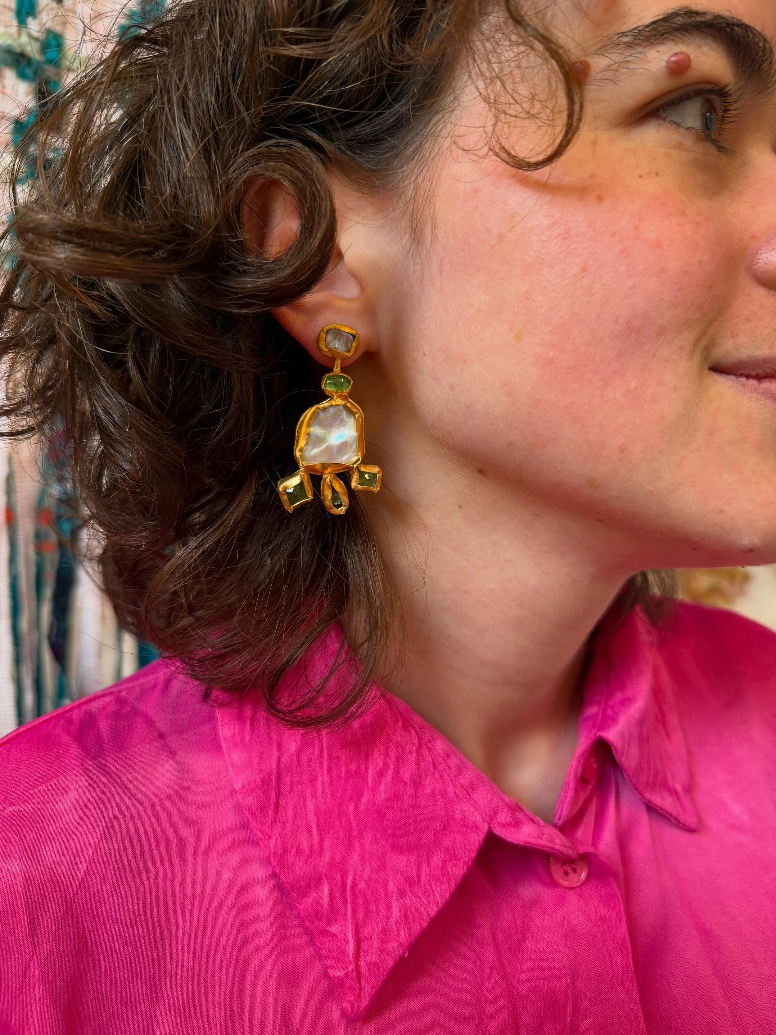 The wonderful @eva__the__weaver looking divine in fuchsia, wearing the Tourmaline Baroque Talisman Earrings. Discover the Fallen Relics collection at @cockpitstudios Open Studios.