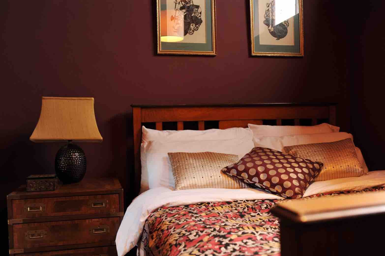 Plum bedroom exotic decor.jpg