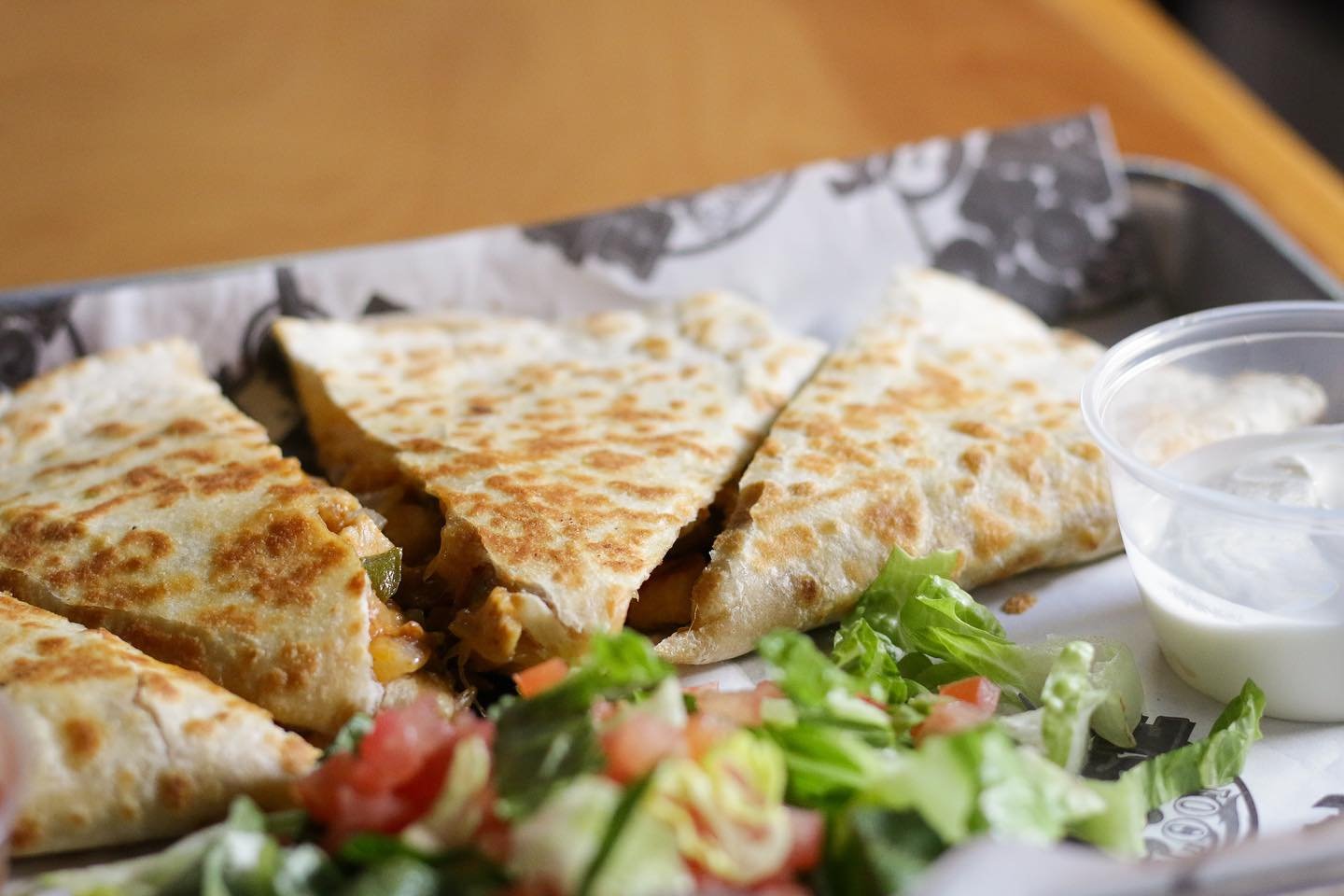 Satisfy your cravings with a refreshing drink and our mouthwatering quesadillas at Dawg House!