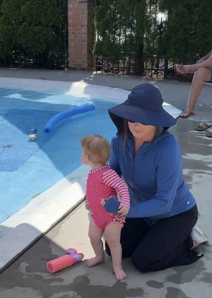 woman in the pool with sun protective gear