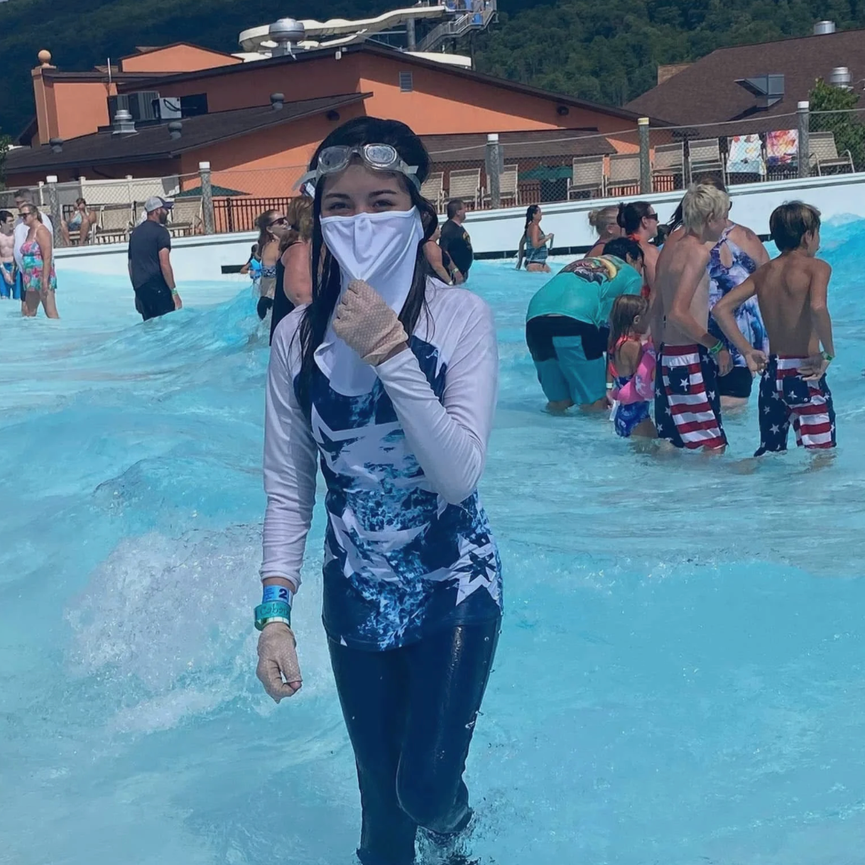 girl with protective gear at the pool