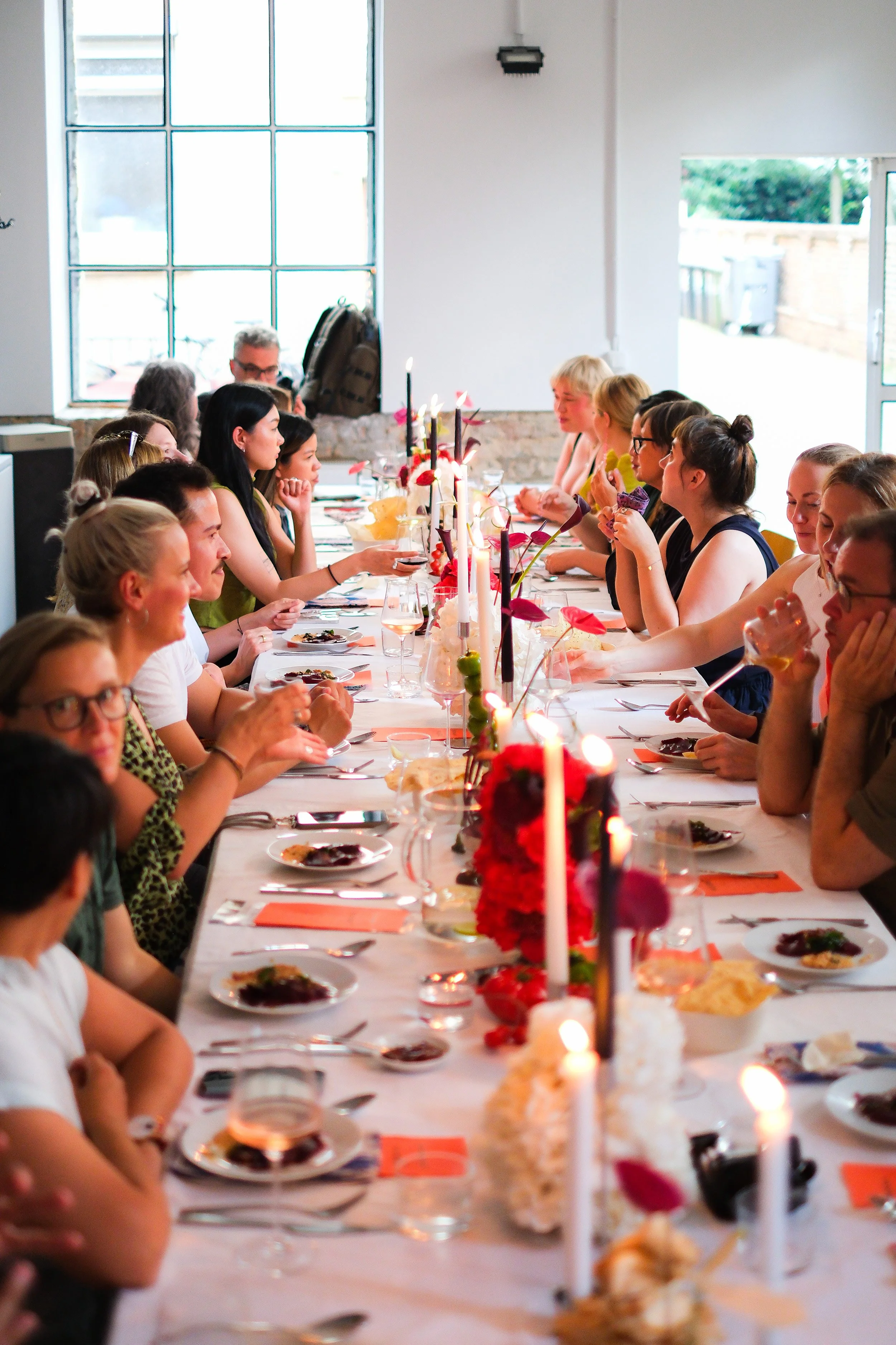 Guests gathered around one long table during KISMET Nights, an intimate supper club at KISMET.