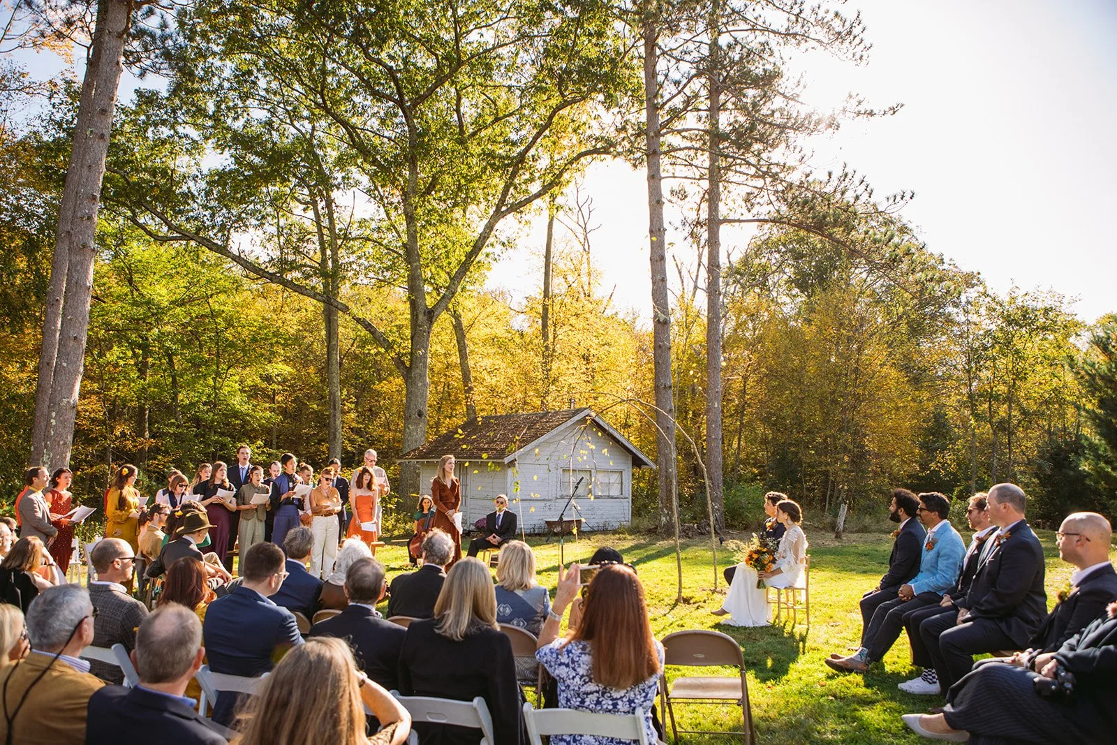 Backyard wedding ceremony in Foster Rhode Island with natural greenery
