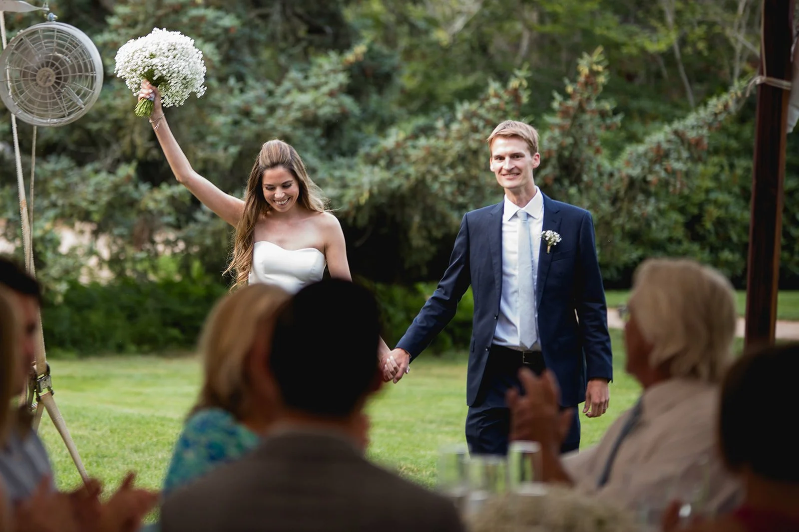 Bride and groom entering reception and celebrating with guests at Estate at Moraine Farm wedding in Beverly, Massachusetts