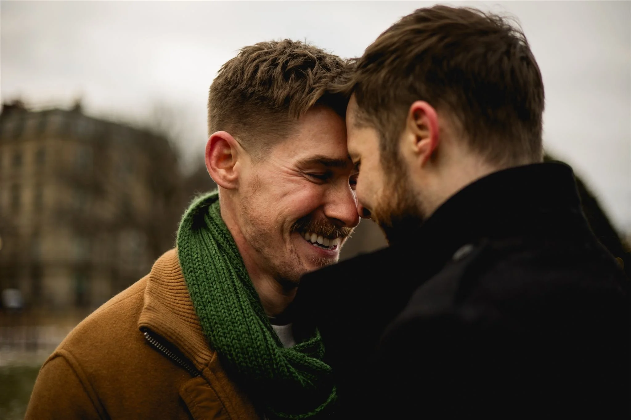 Close-up of an engaged couple smiling forehead to forehead during a Boston engagement photo session.