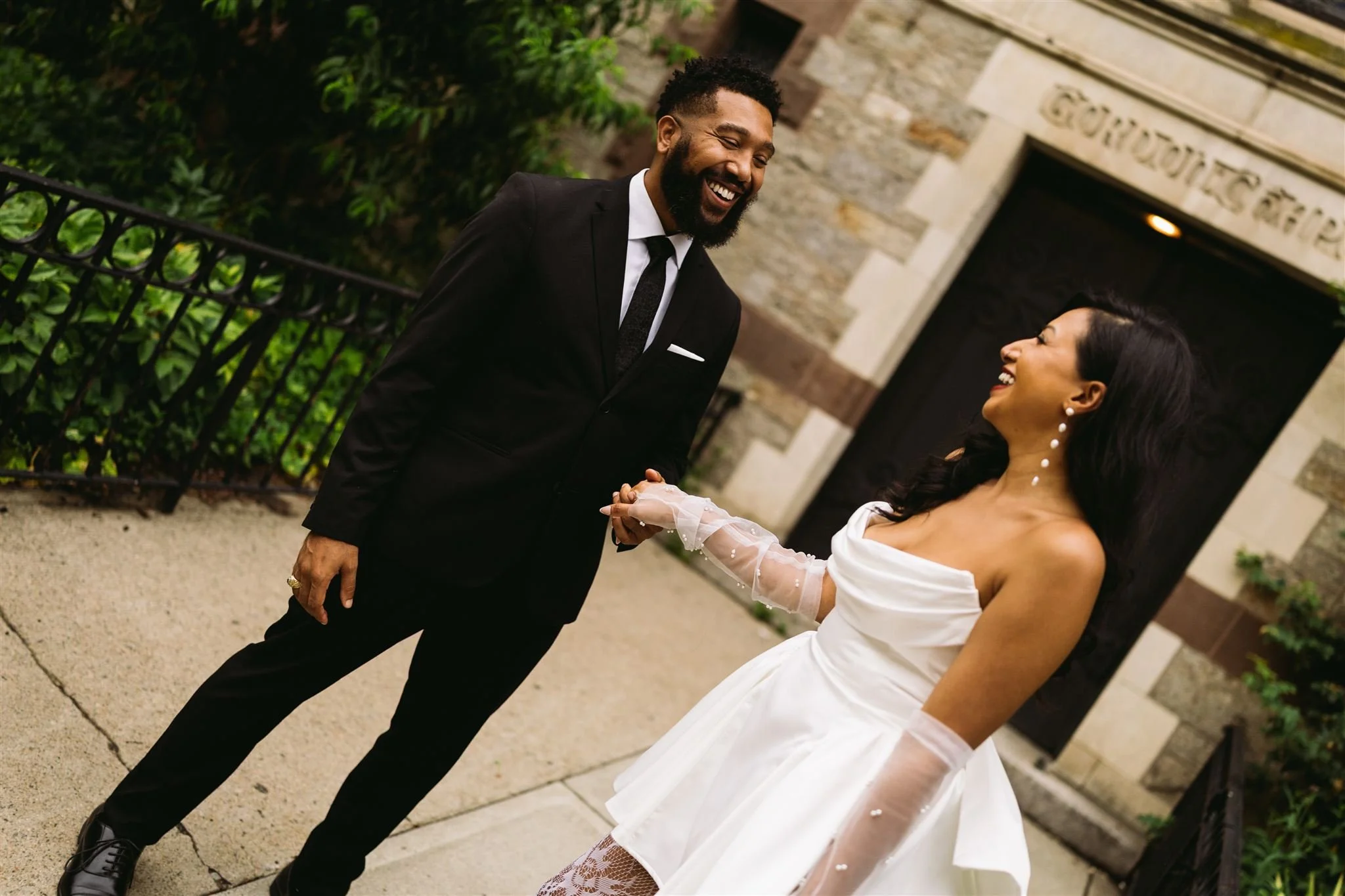 Engagement photos at Old South Church Gordon Chapel in Boston with couple kissing in front of historic stone architecture