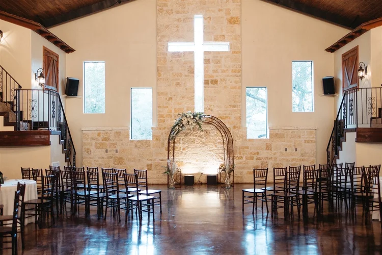 Reception hall with the 11-foot glass cross set into the rock wall