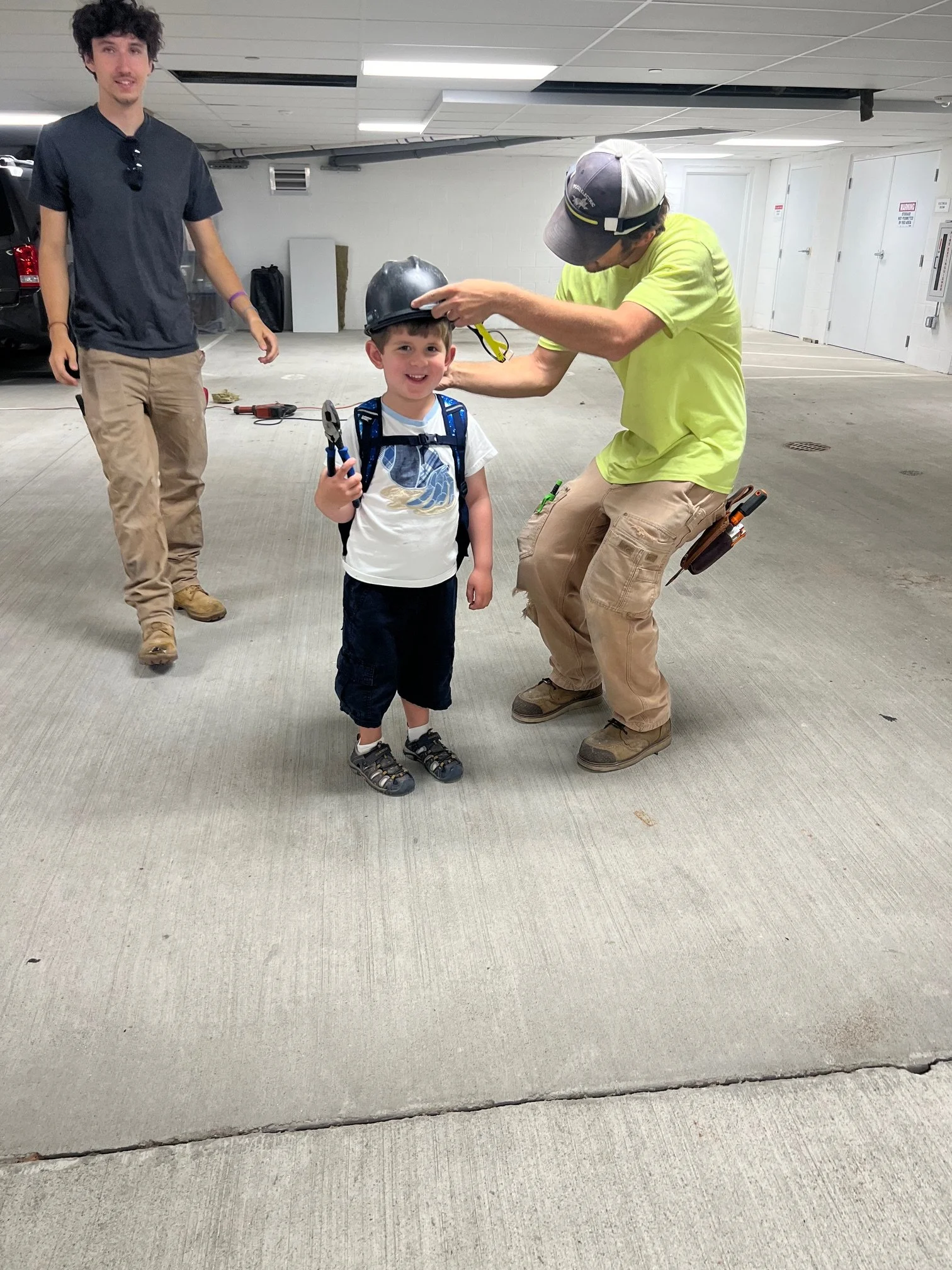 Electricians from solar installation give resident a demonstration