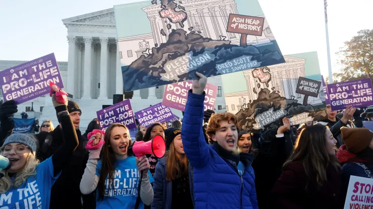 Pro-life activists protest outside the Supreme Court building, ahead of arguments in the Mississippi abortion rights case Dobbs v. Jackson Women’s Health, in Washington, U.S., December 1, 2021. Credit: Jonathan Ernst | Reuters