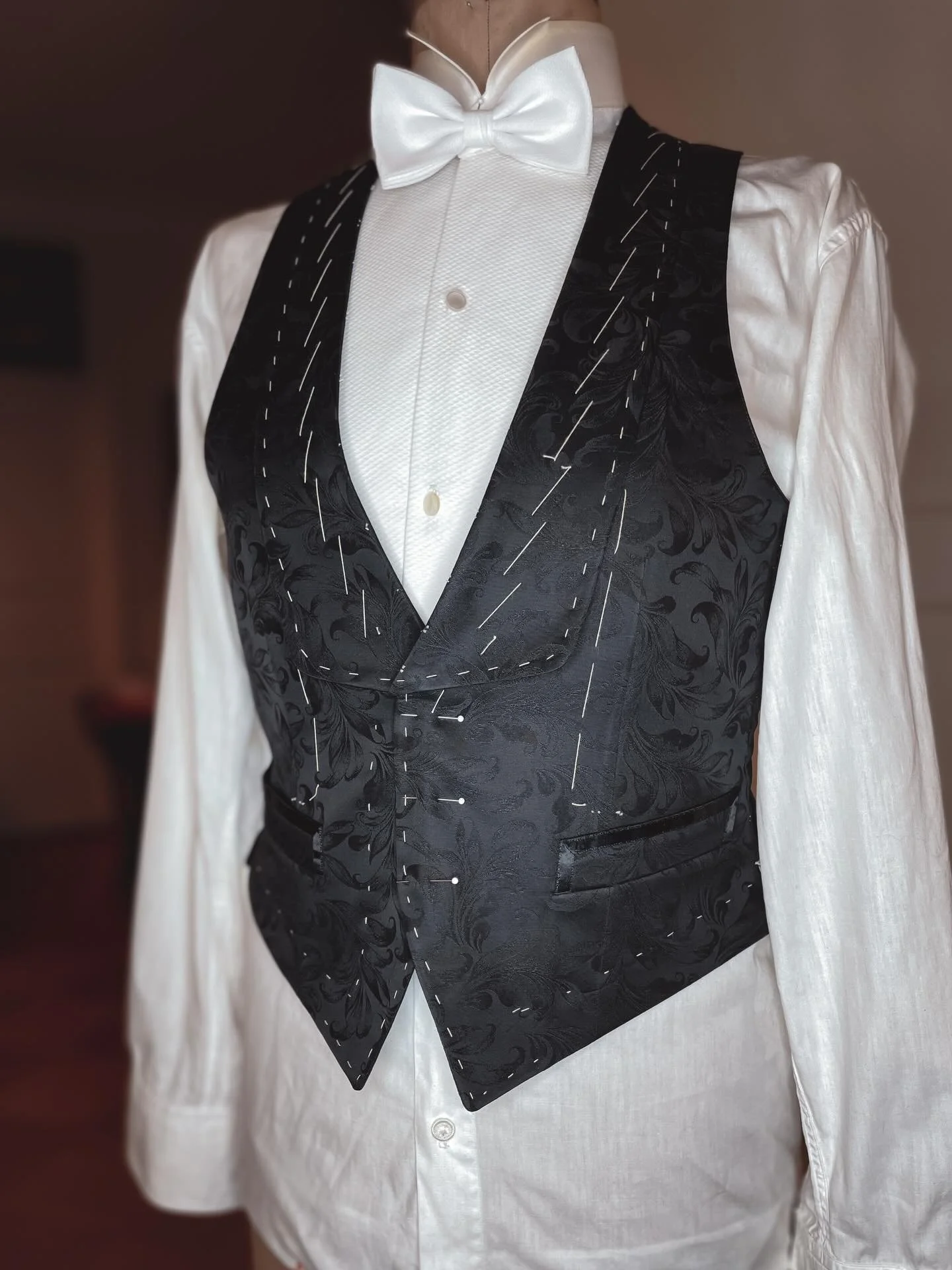 Working on a beautiful formal black waistcoat inspired by patterns from our old cutting books. 
I took a little creative liberty and added satin trim to the pocket edges, which was definitely the right decision!After the fitting, I&rsquo;ll finish it