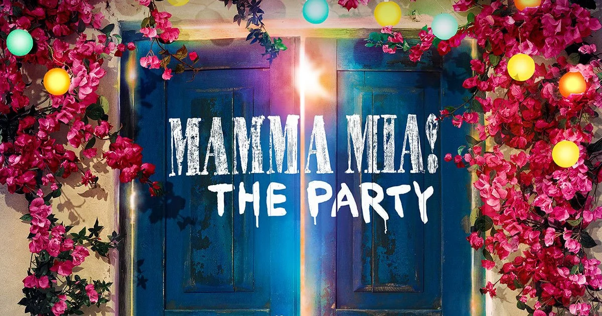 Decorative entrance with pink bougainvillea flowers, colorful string lights, blue double doors, and a sign that reads "MAMMA MIA! THE PARTY" in white bold letters.