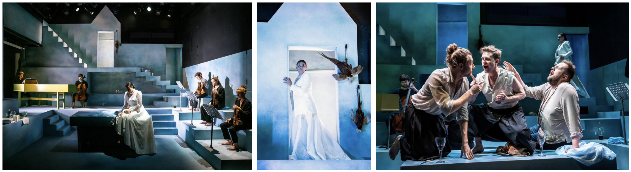A theatrical stage play with a minimalist set design in shades of blue. The first panel shows musicians playing string instruments, with a woman in a white dress sitting on stairs. The second panel features a woman in a white gown emerging from a doorway with a bird near her. The third panel depicts actors in dramatic poses, two kneeling and gesturing intensely, with a woman standing in the background.
