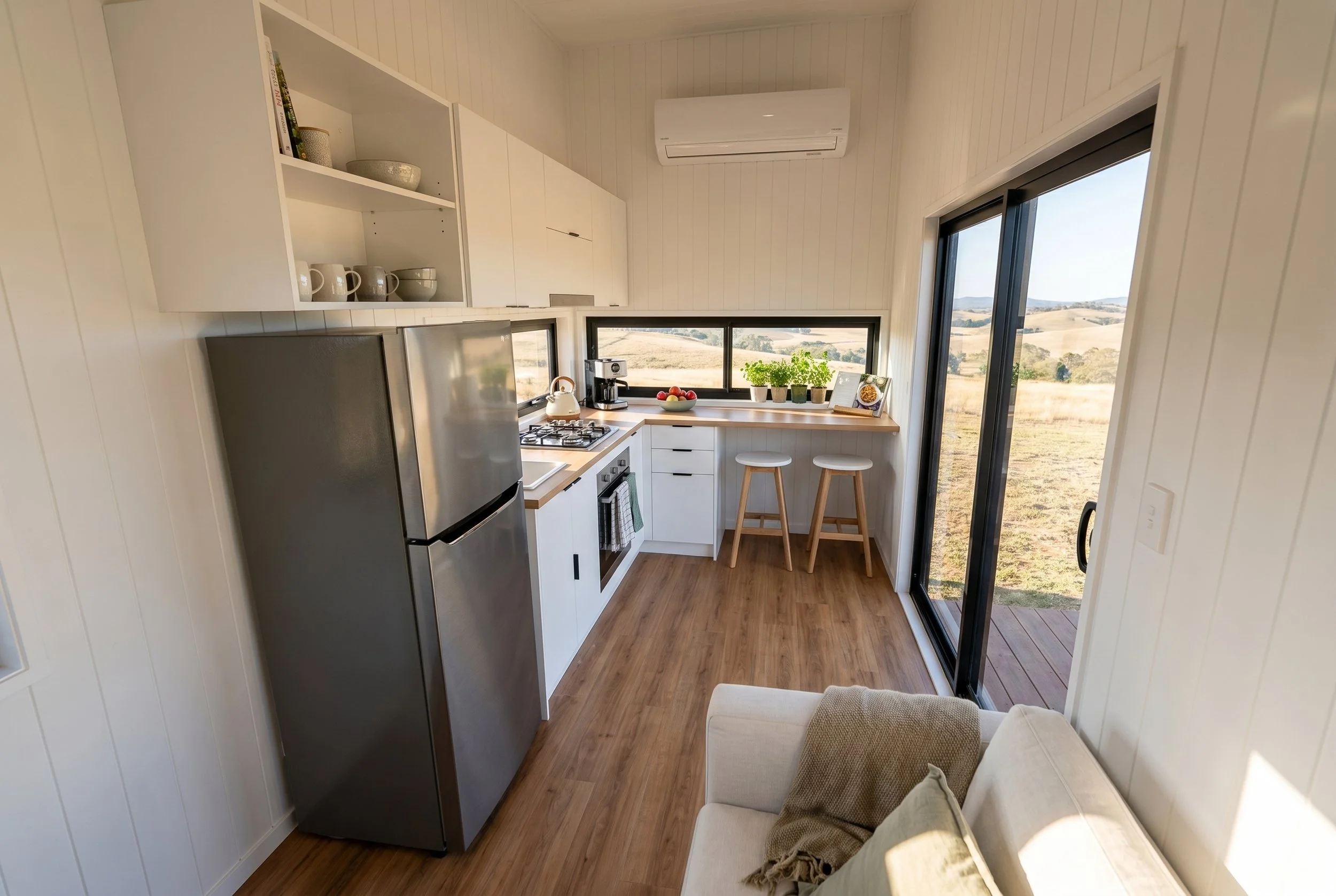 Maple 9.0 is a single level 1-bedroom Tiny Home by Oz Tiny Homes in Australia, designed for off-grid living with a modern timber look and double-glazed windows