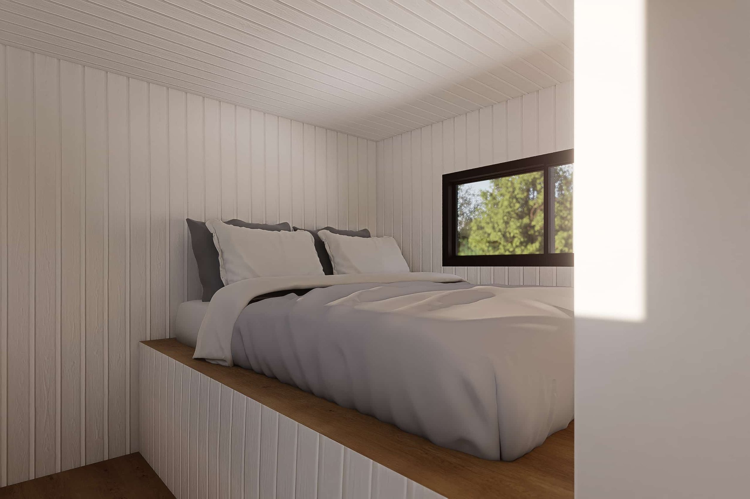 A cozy bedroom nook with a bed against a white paneled wall, a window with greenery outside, and soft natural lighting.
