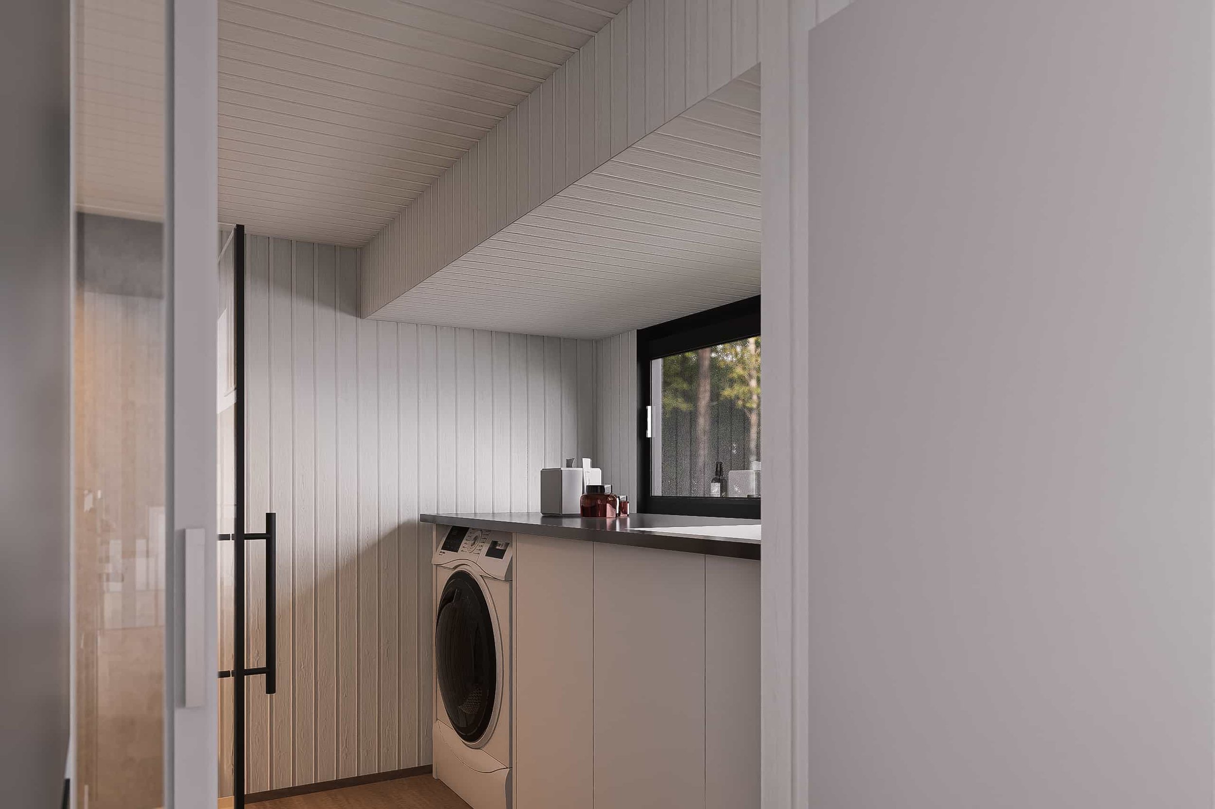 Laundry room with white walls, a window, a front-loading washing machine, and minimal decor.