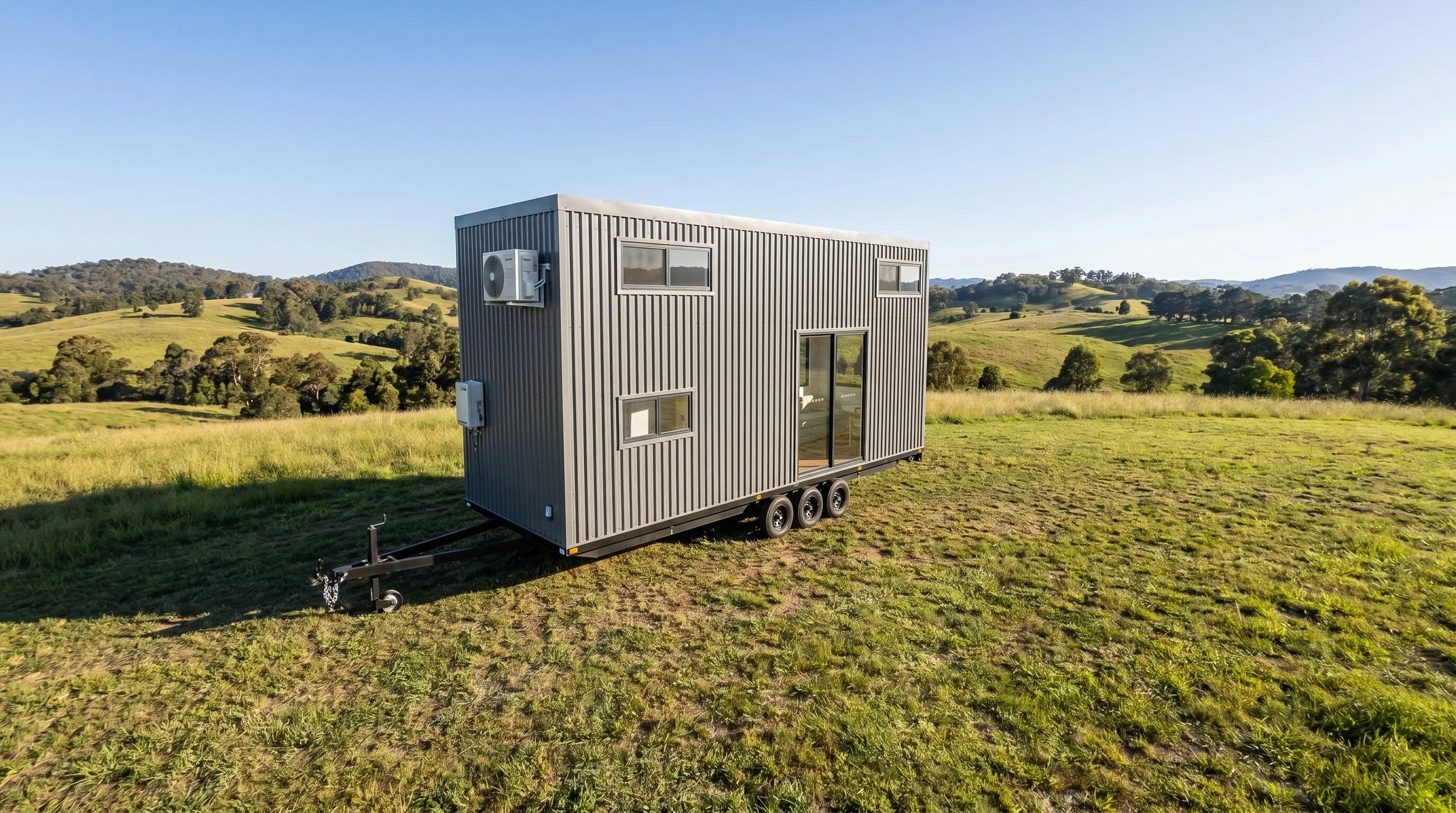 The Cedar 7.0 is a 2-bedroom Tiny Home by Oz Tiny Homes in Australia, designed for off-grid living with a modern timber look and double-glazed windows