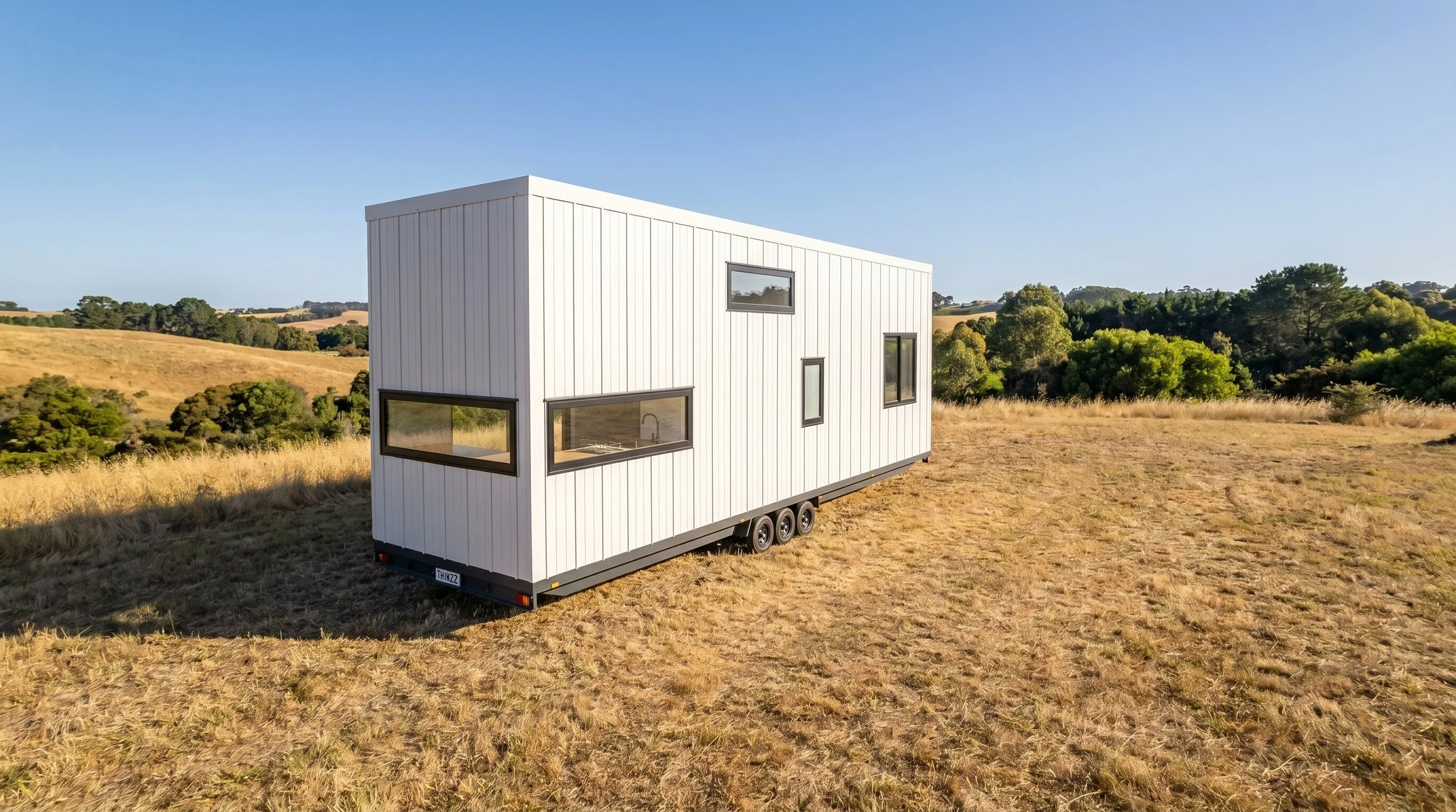 Maple 9.0 is a single level 1-bedroom Tiny Home by Oz Tiny Homes in Australia, designed for off-grid living with a modern timber look and double-glazed windows