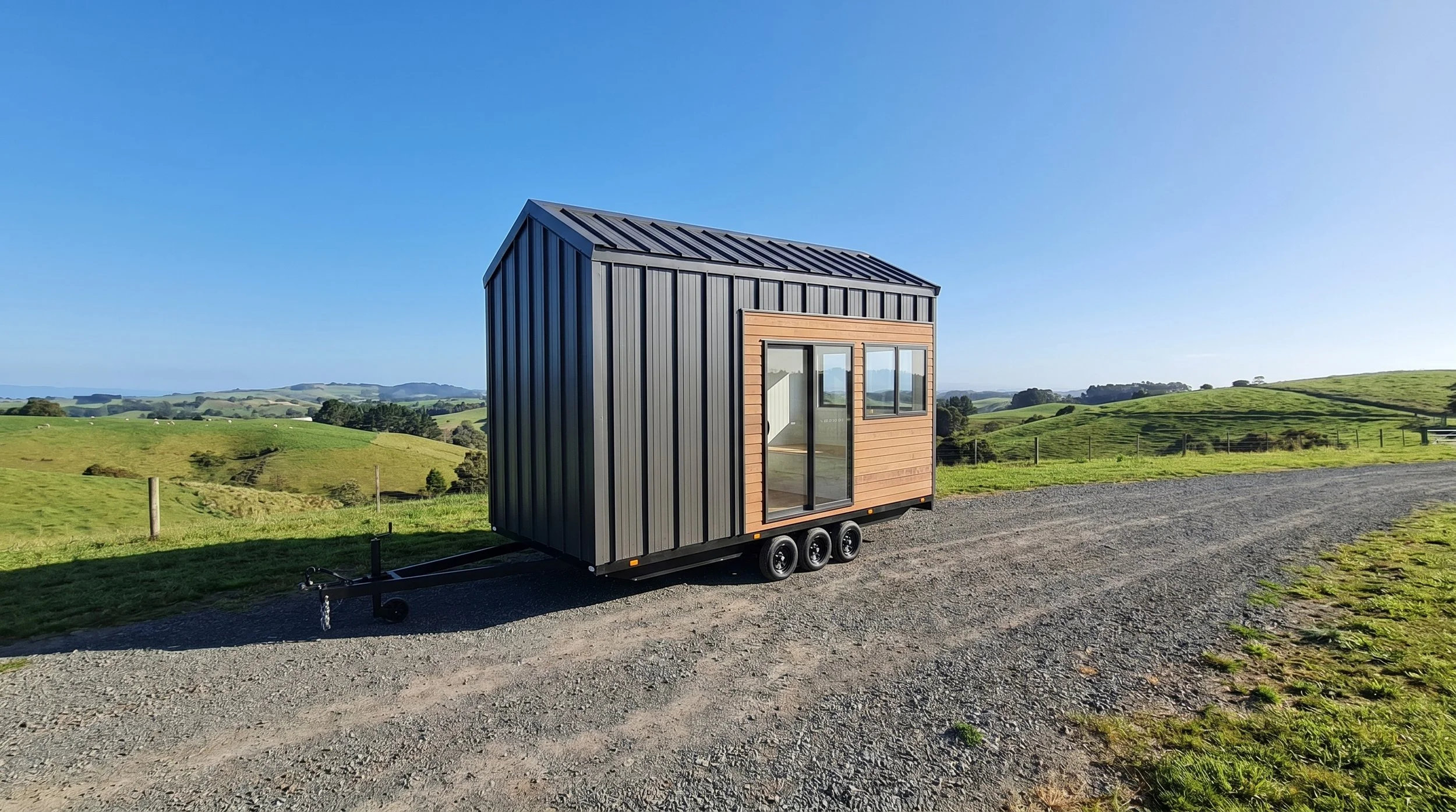 Gumnut 5.0 is a single level 1-bedroom studio Tiny Home by Oz Tiny Homes in Australia, designed for off-grid living with a modern timber look and double-glazed windows