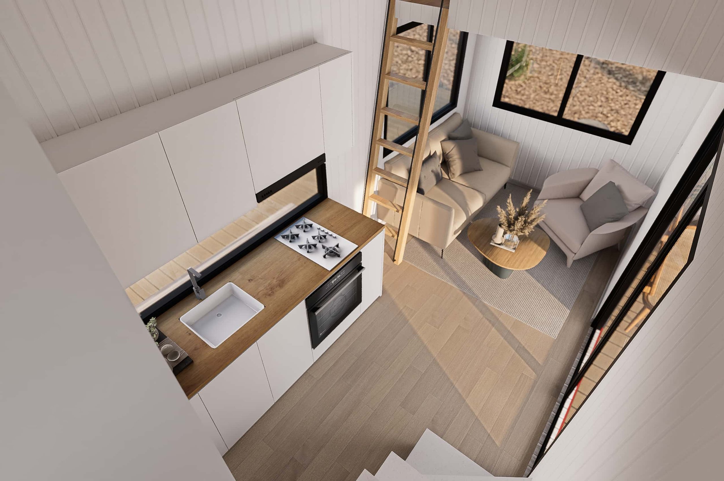 A modern, compact kitchen with white cabinets, a wooden countertop, a gas stove, a sink, and a built-in oven. Adjacent is a cozy living area with two beige sofas, a wooden coffee table with a vase of dried flowers, large windows, and a wooden ladder