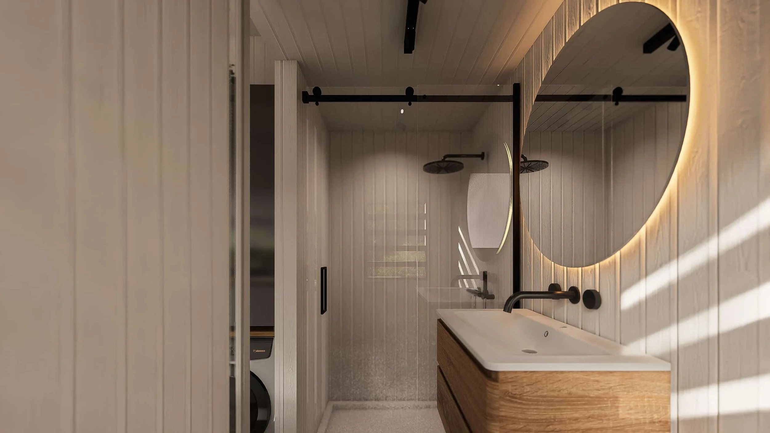 Modern bathroom with wooden accents, a round backlit mirror, black fixtures, and a walk-in shower with a glass door.
