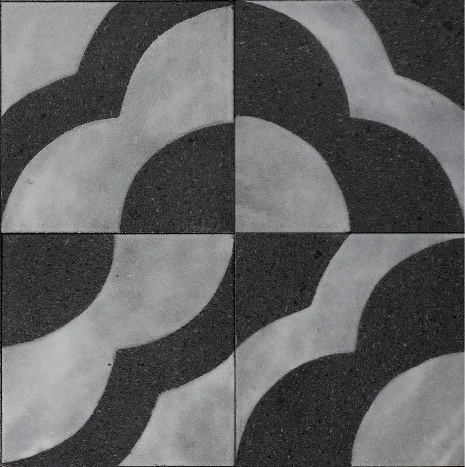 Black and gray geometric pattern consisting of curved shapes arranged symmetrically.