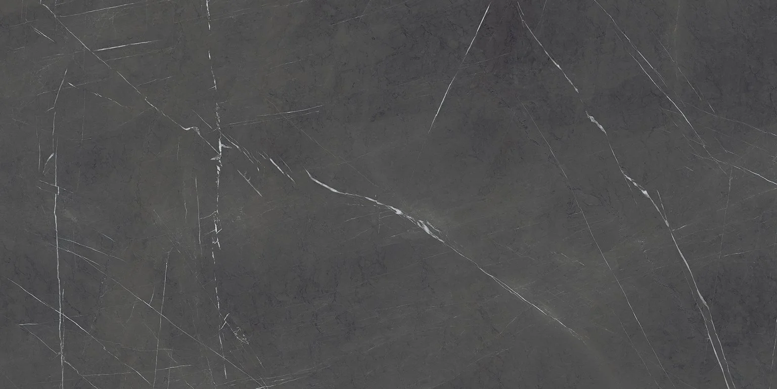 Close-up of a dark gray marble surface with white veining.
