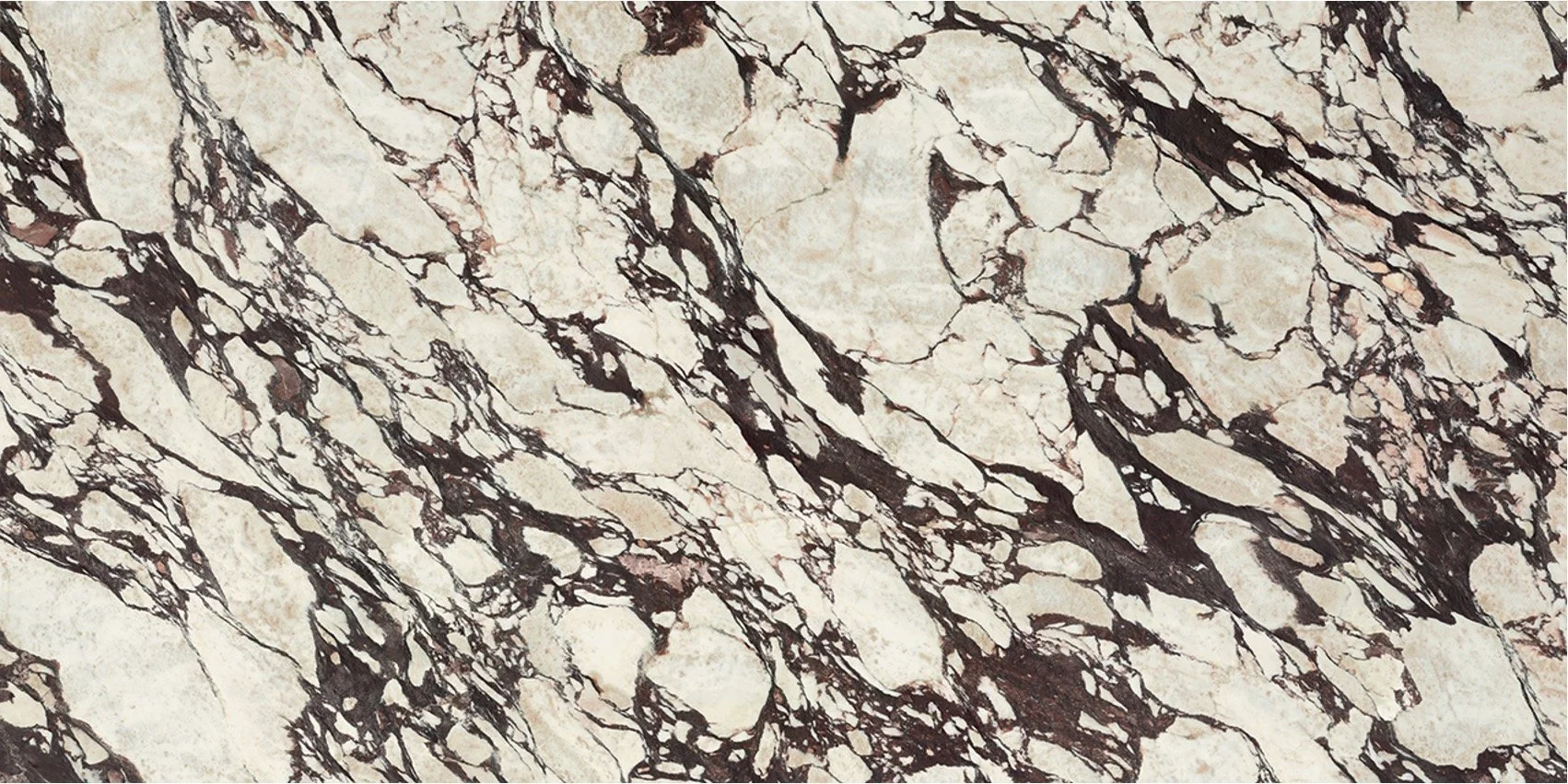 Close-up of a marble surface with cream and dark brown veining patterns.
