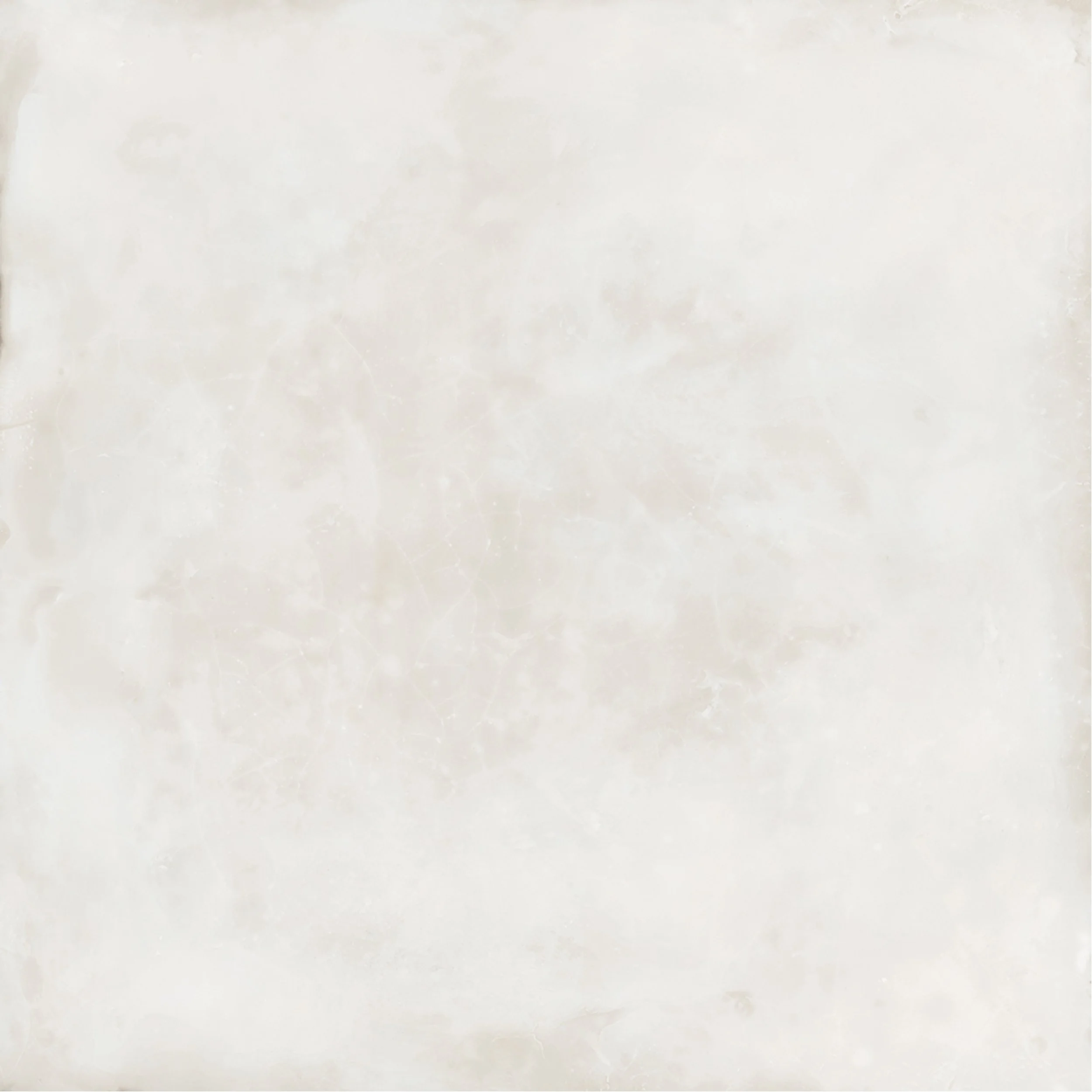 A plain, textured, off-white surface resembling a marble or stone material