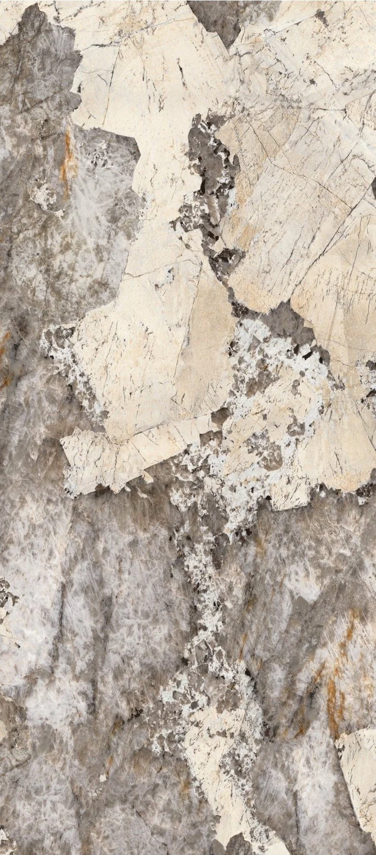 Close-up of a weathered, peeling marble or stone surface with cracks and layered sections in shades of gray, white, and beige.