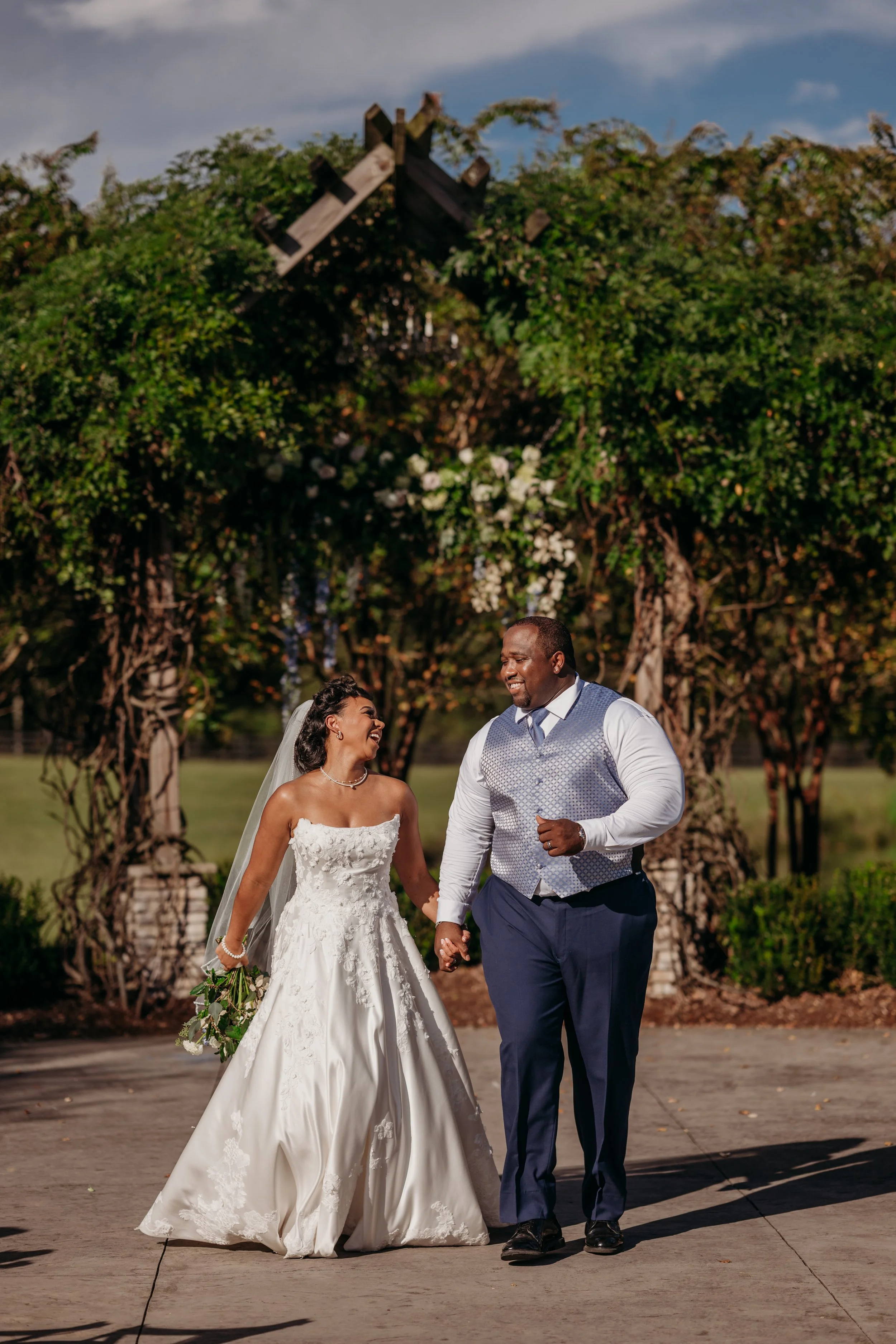 Chattanooga wedding florist blue white blush delphinium dahlia black bride summer florals garden style howe farms apple barn arbor floral chandelier hanging florals black bride