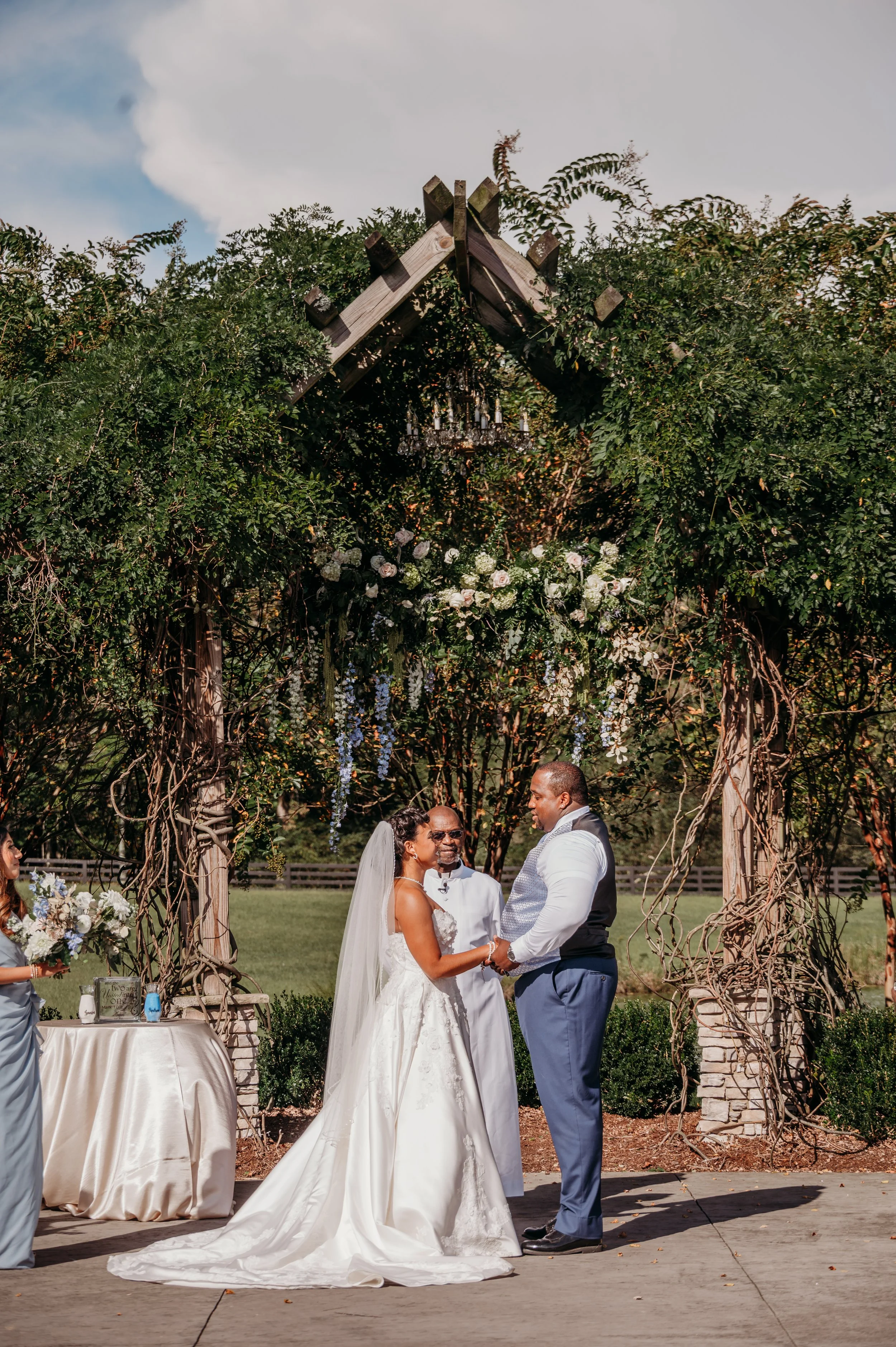 Chattanooga wedding florist blue white blush delphinium dahlia black bride summer florals garden style floral chandelier arbor florals hanging florals