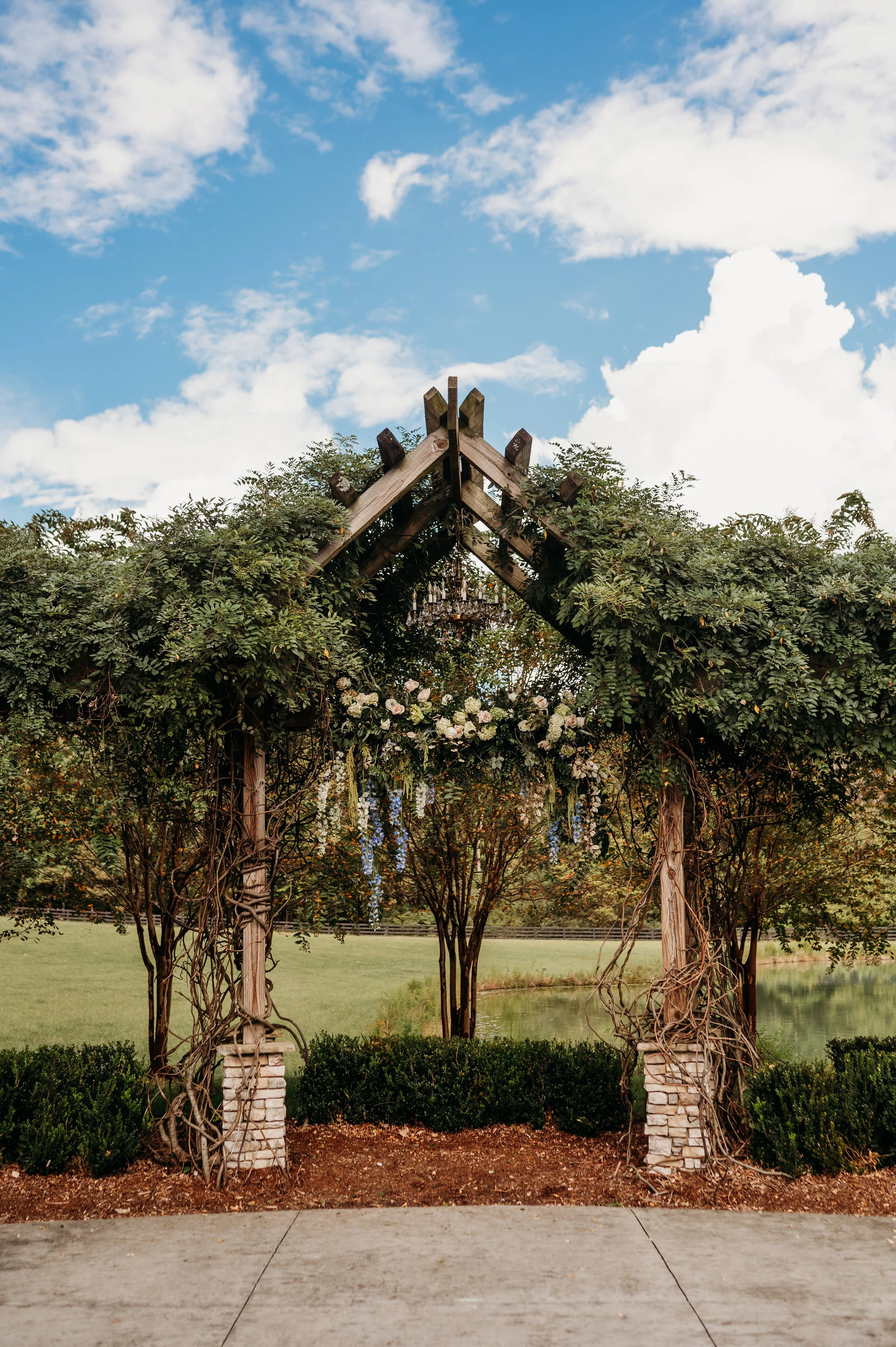 Chattanooga wedding florist blue white blush delphinium dahlia black bride summer florals garden style floral chandelier