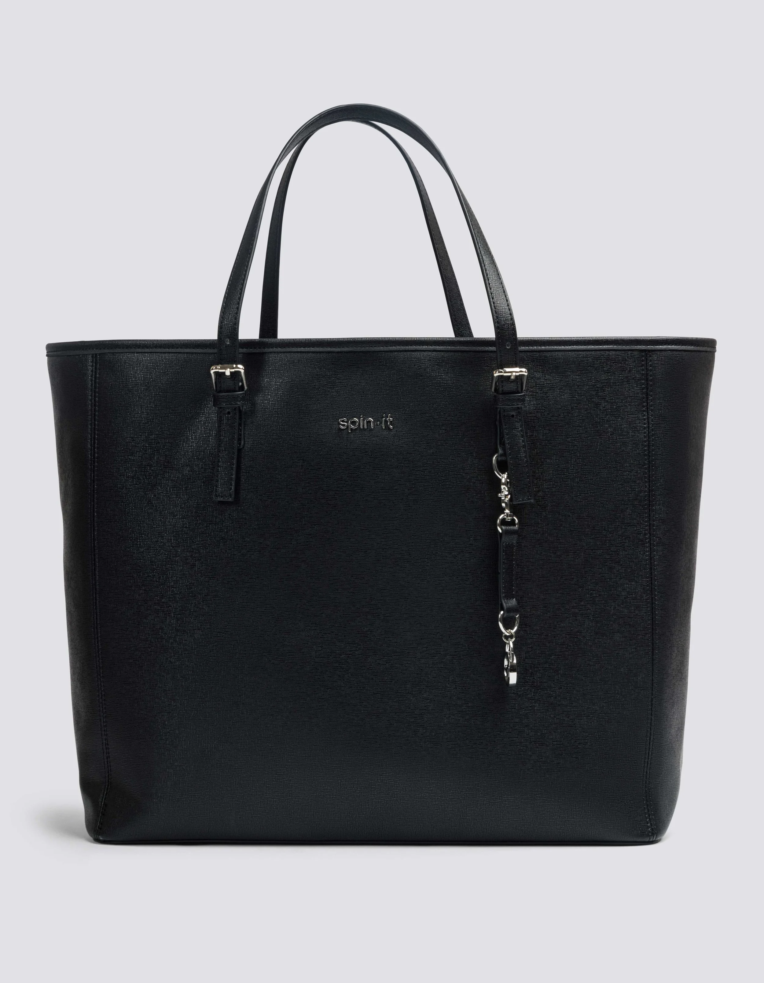 A black tote bag with the brand name "spin it" on the front, featuring two top handles and a chain with clips hanging from a strap.