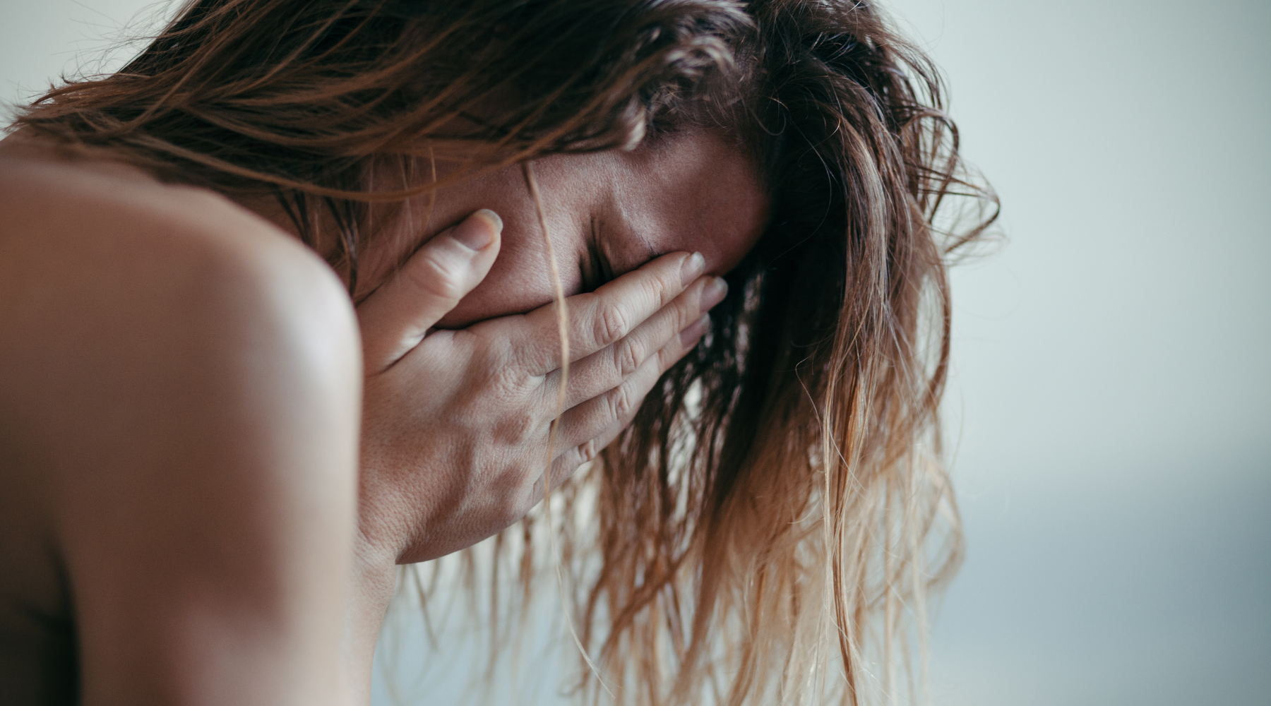 Overwhelmed mother managing mental load while juggling multiple tasks, questions, and family responsibilities simultaneously