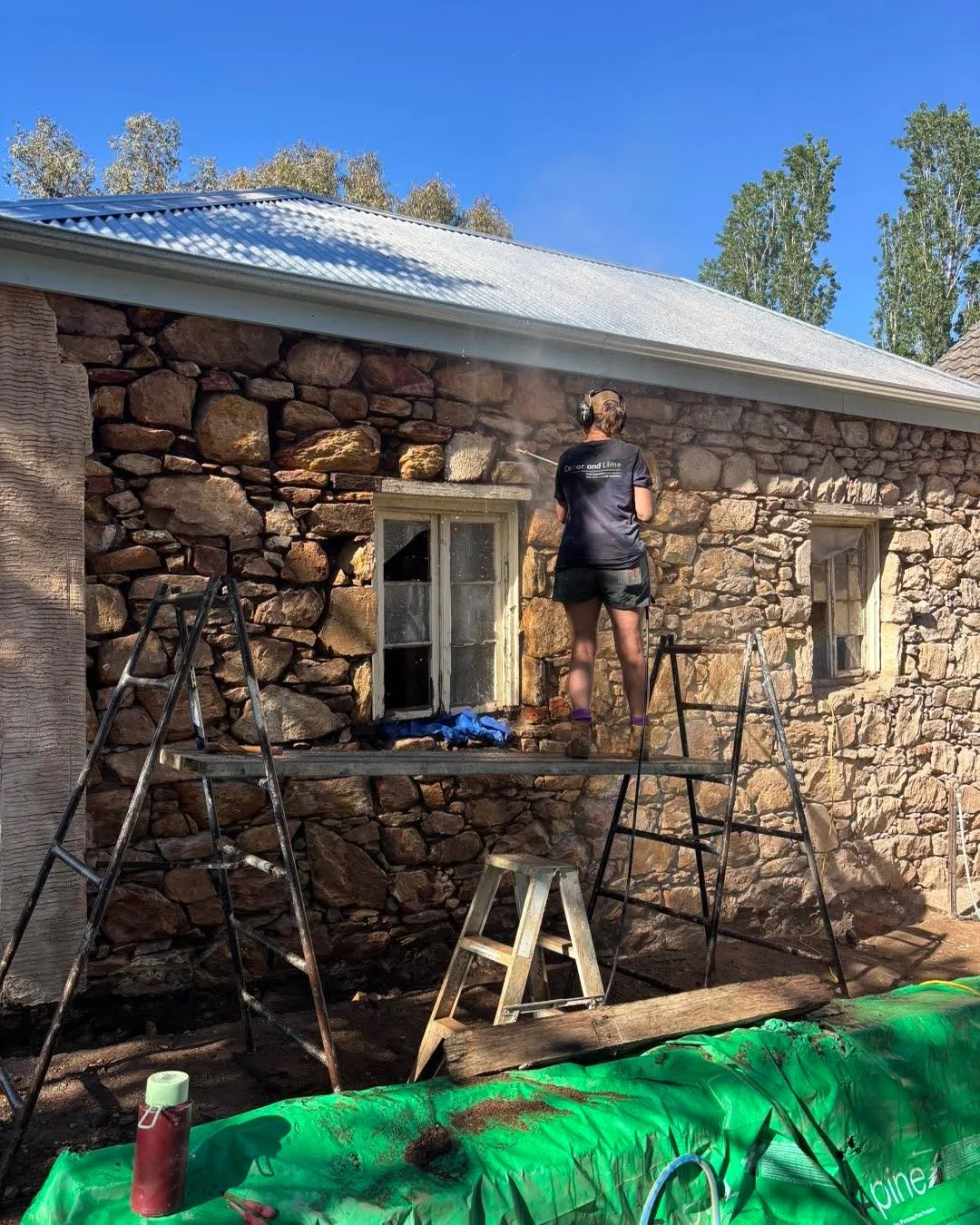 Alison cooling off Cedar and Lime style in the 30 degree morning. More importantly getting the stubborn sand and cement render residue off the stone. Ready to beautify and repoint. 
Love a wet tee shirt! Love my job!!
#stonerestoration #heritageresto