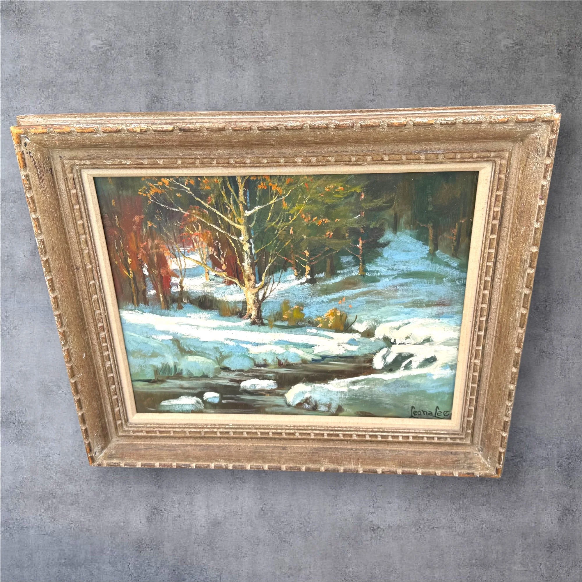 Leona Lee (American, Mid-20th Century)  “Winter Creek in the Pines” – Original Oil on Canvas, 25” × 21” (on Fulton Board)