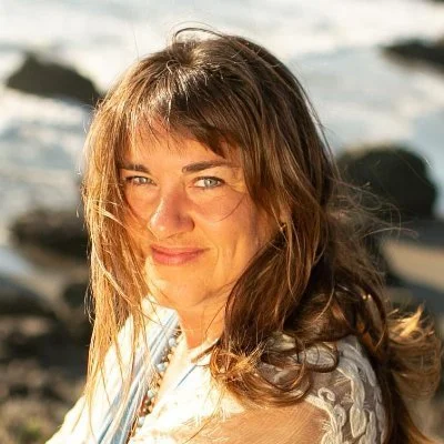 Lissa Rankin, MD, author, smiling near the beach and sharing a testimonial about Laura Schmidt’s IFS work