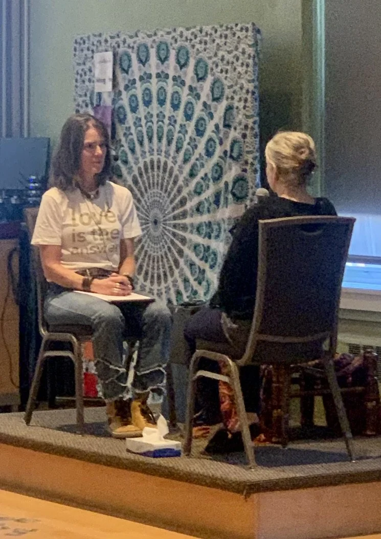 Two participants in an IFS retreat engaged in a guided session or consultation exercise