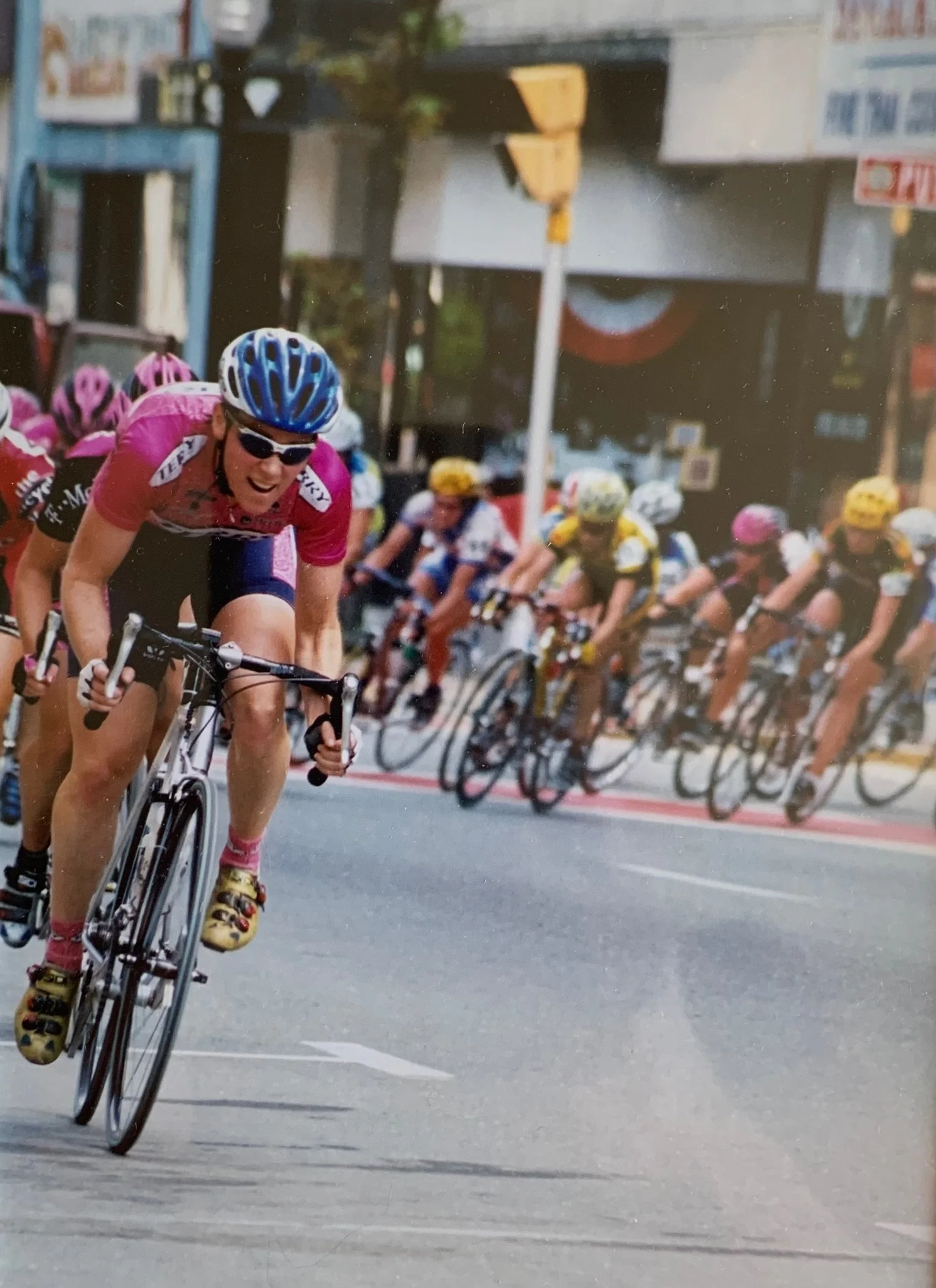 Cyclist leading a competitive road race, representing focus, endurance, and determination