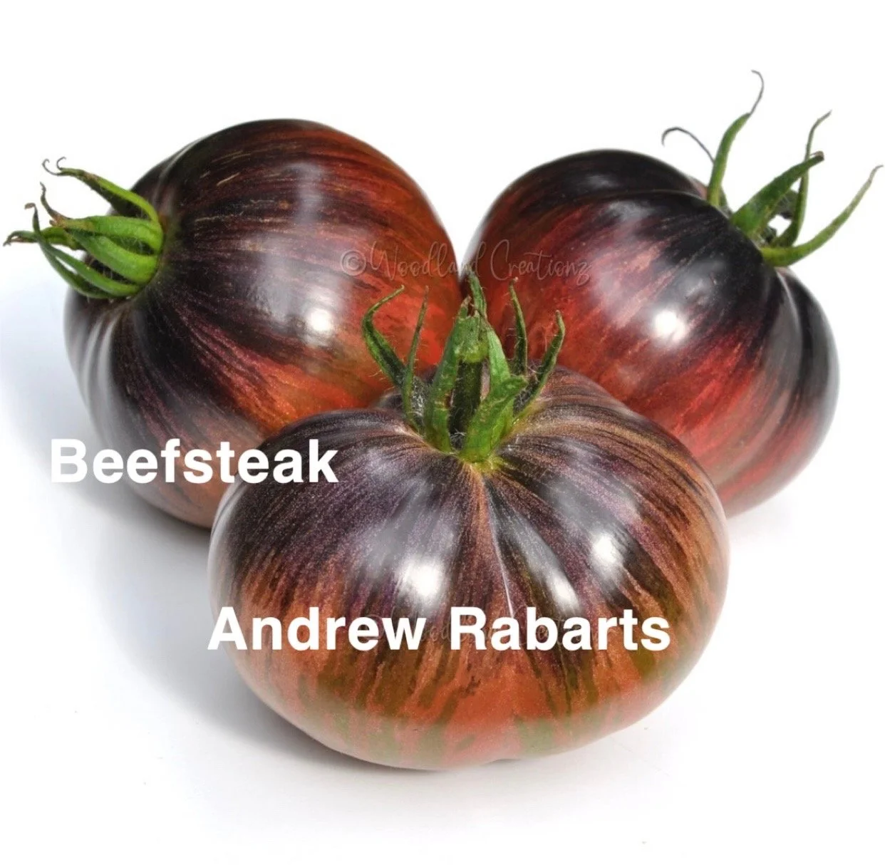 The Andrew Rabarts Heirloom Beefsteak is a striking, high‑flavor variety known for its deep, rich coloring and bold, old‑fashioned tomato taste. The flavor is intense and complex—sweet at the start with a deep, savory undertone and balanced acidity—m