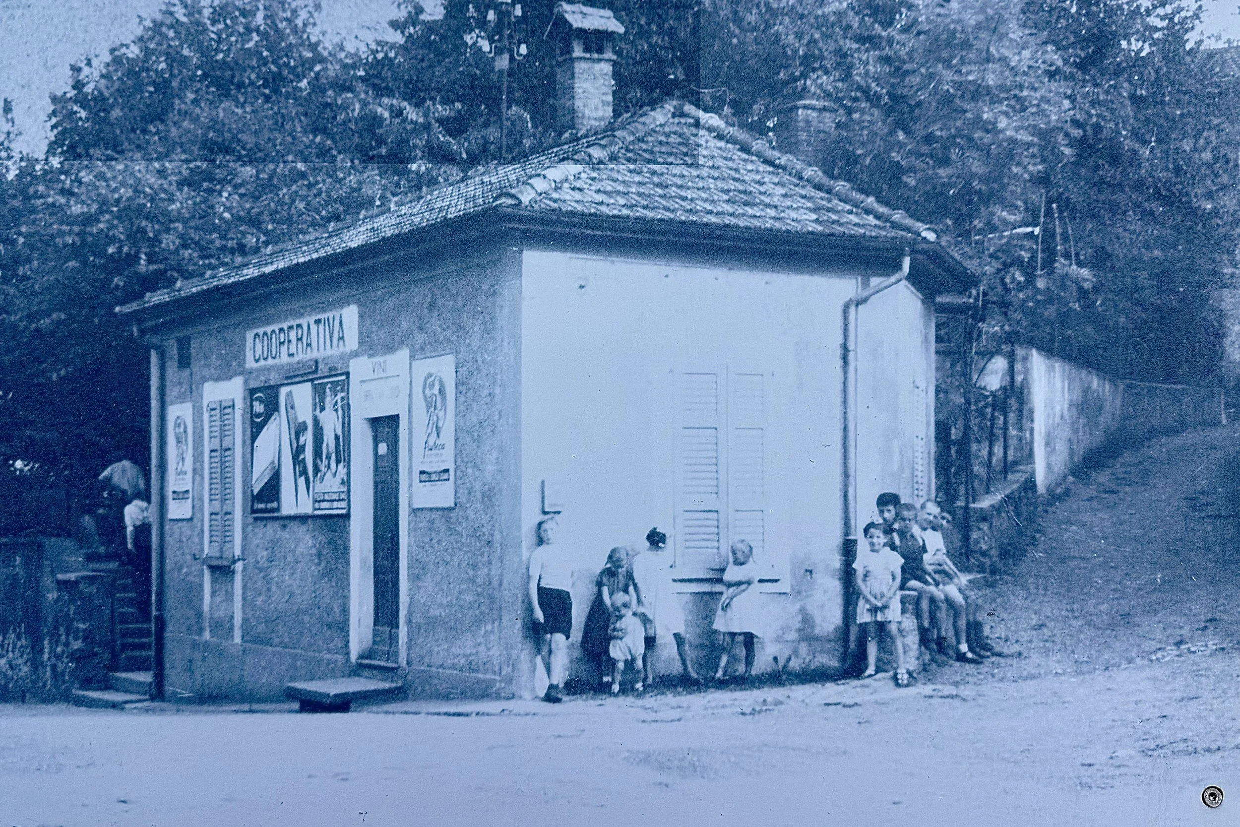 This building is still here but there is now a second floor.  The road where the kids are standing leads up to the BnB.