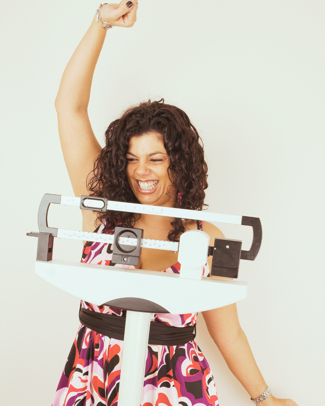 Woman celebrates her progress in the Sapphire Strong program at Sapphire Women's Healthcare.